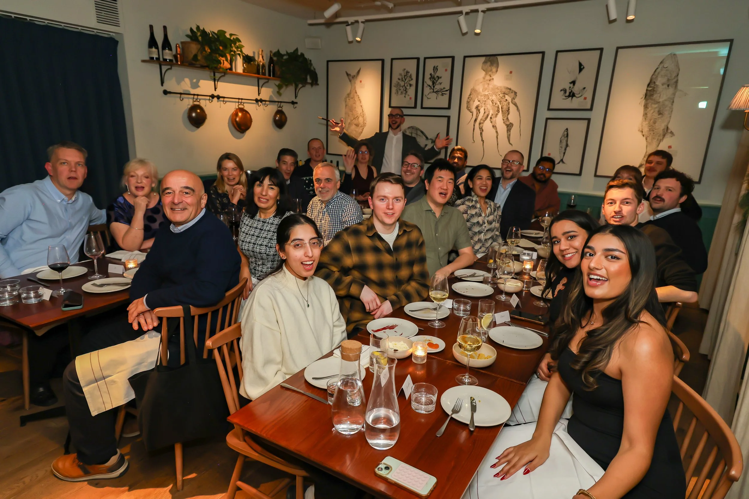Magician with the corporate audiences during formal christmas dinner.
