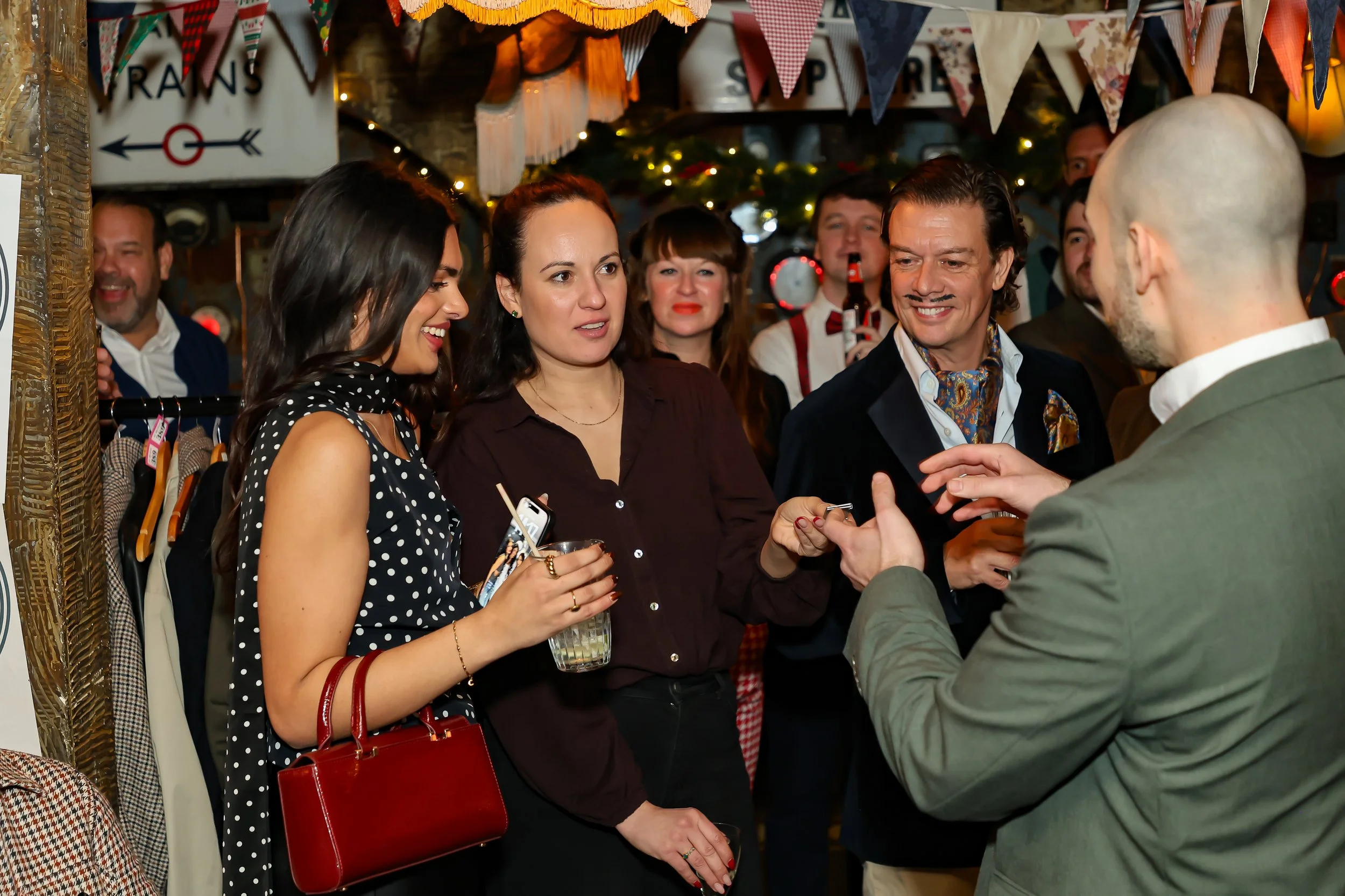 Side-table magic entertaining guests during a corporate social event.