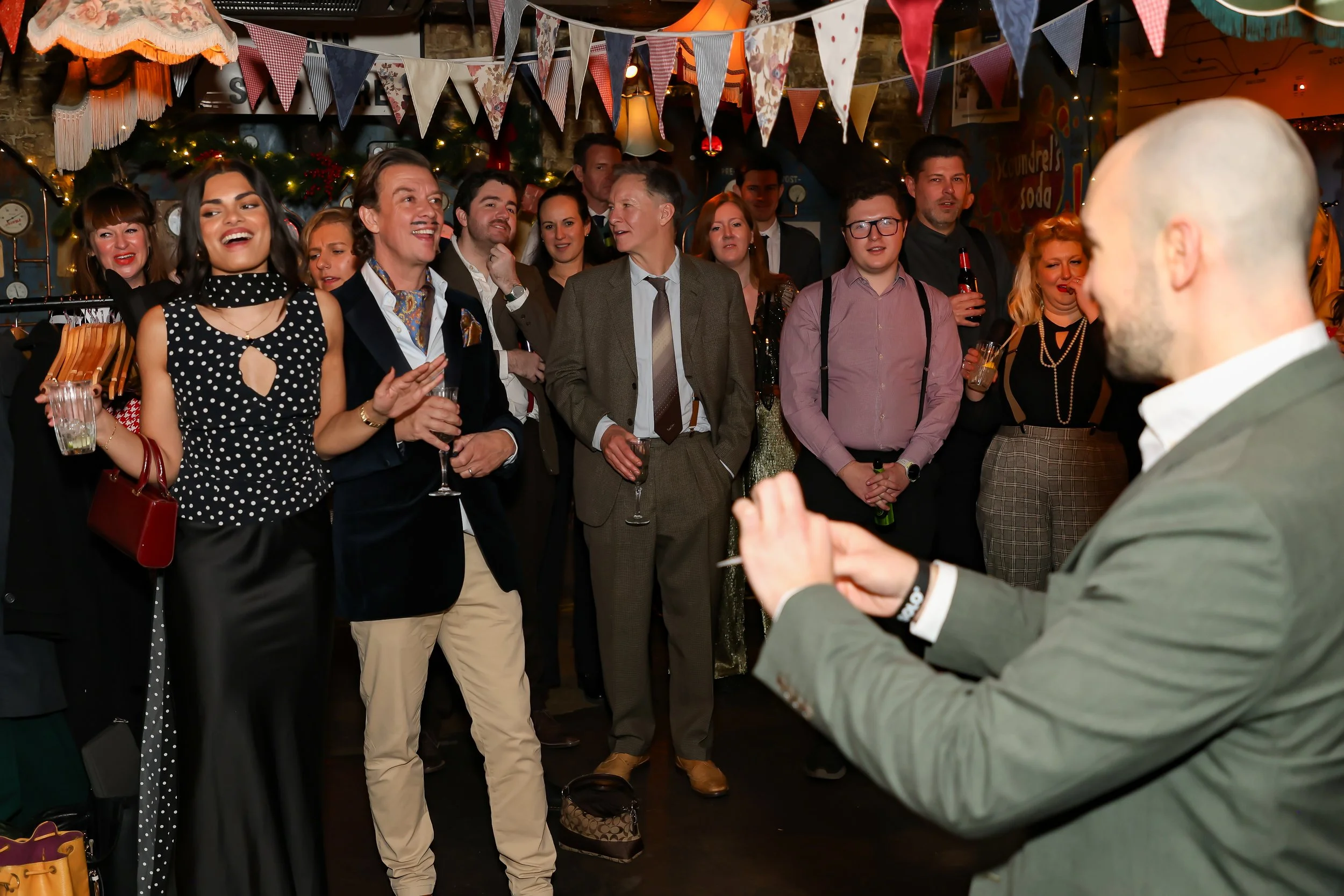 Audience enjoying the live magic show at a corporate event.