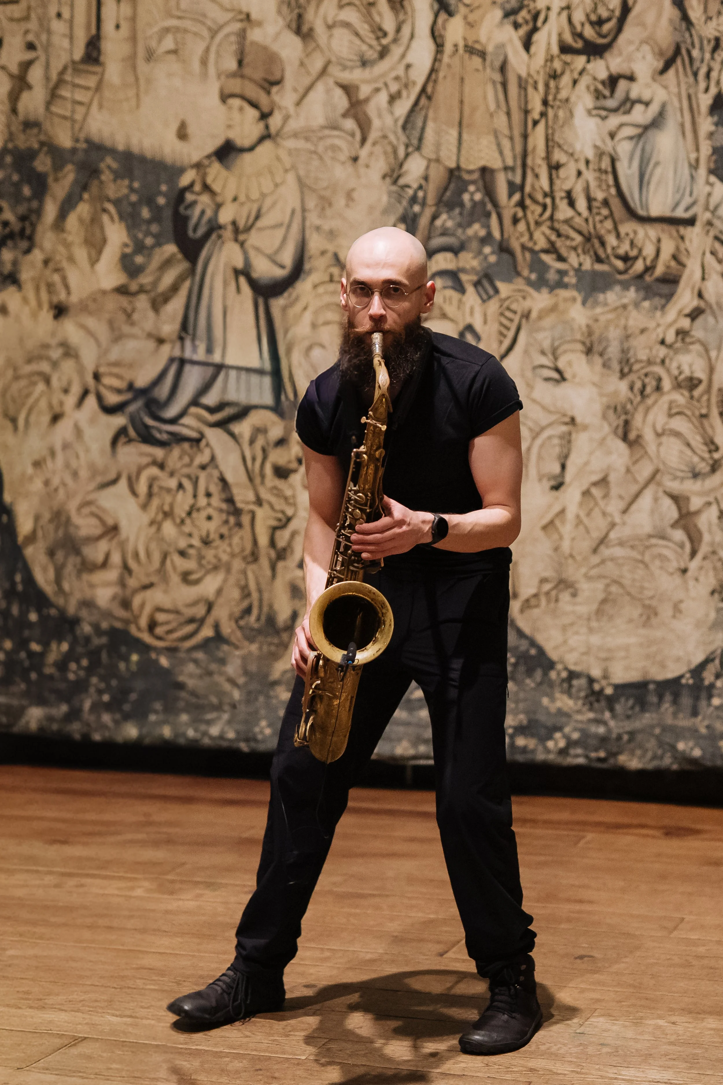 Live saxophonist performing for corporate guests at a London event.