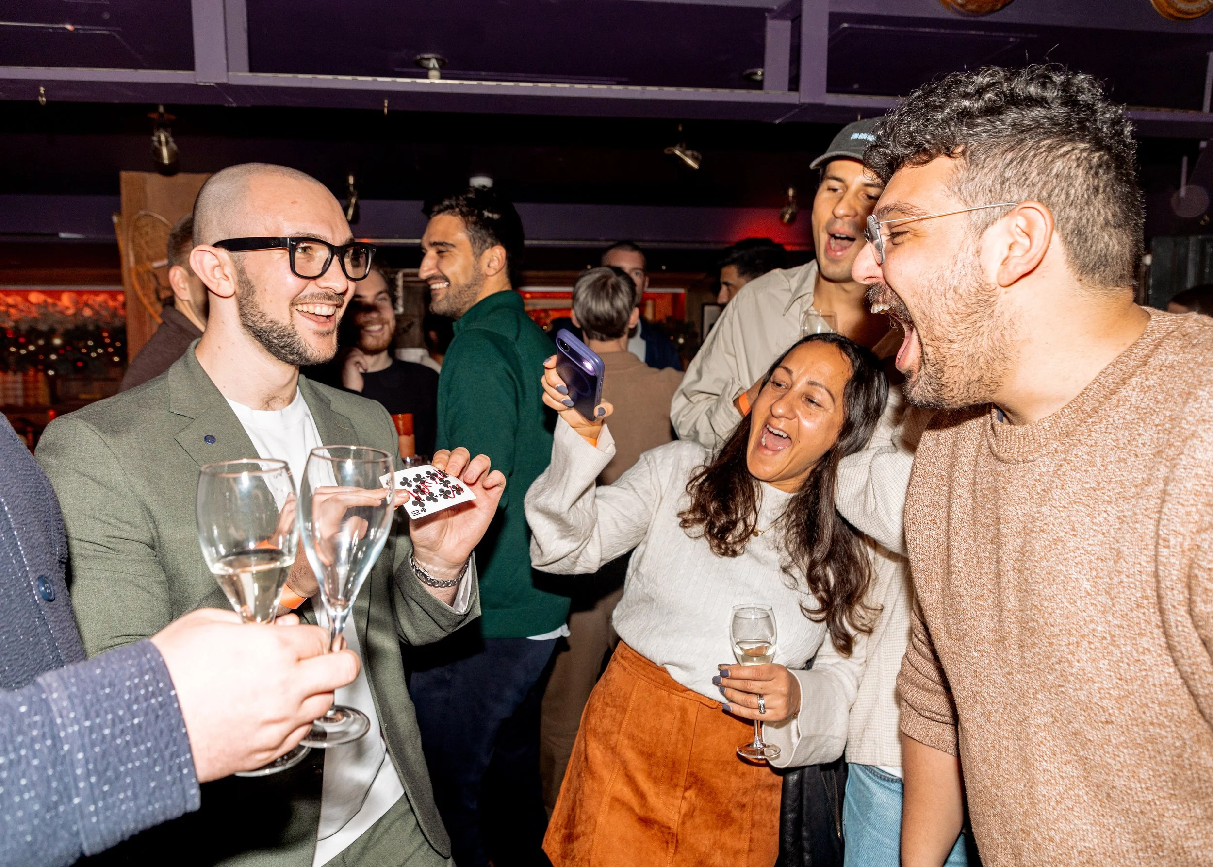 Corporate guest cannot believe magician's walk-around card magic experience.