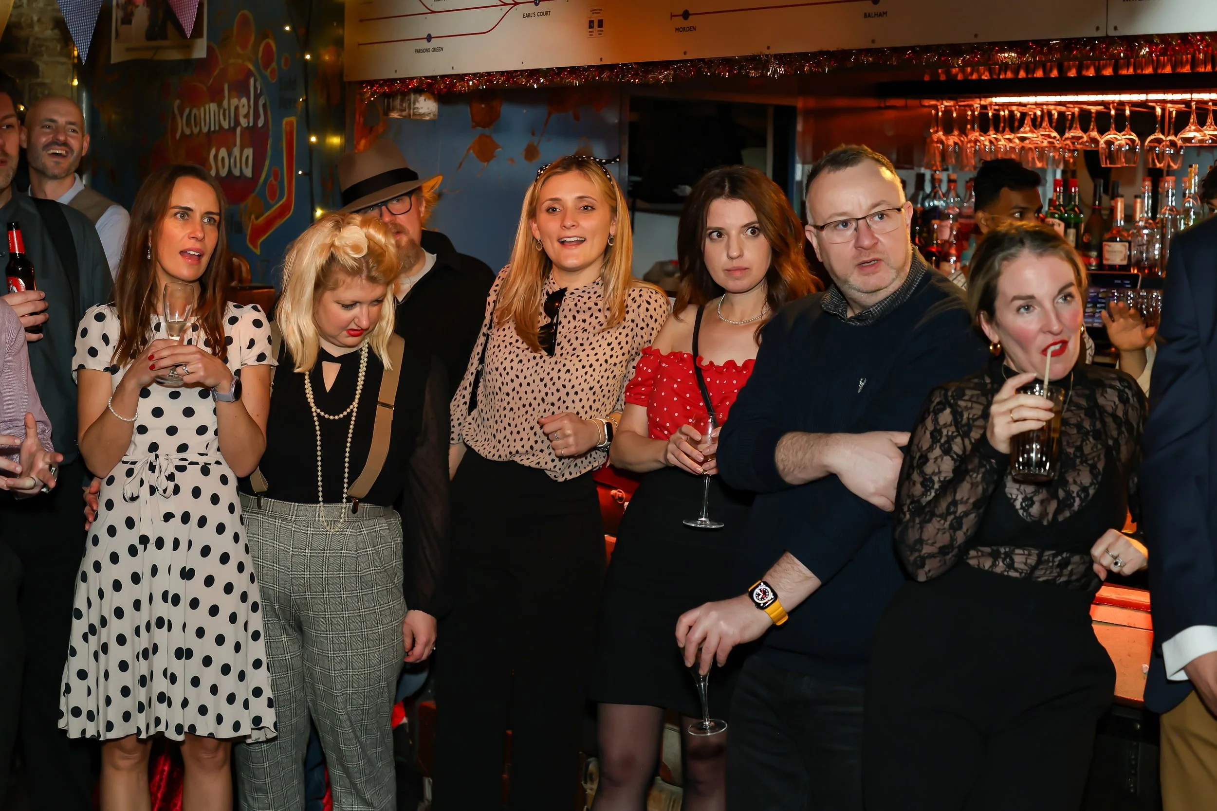 Magician performing walk-around magic for guests at reception.