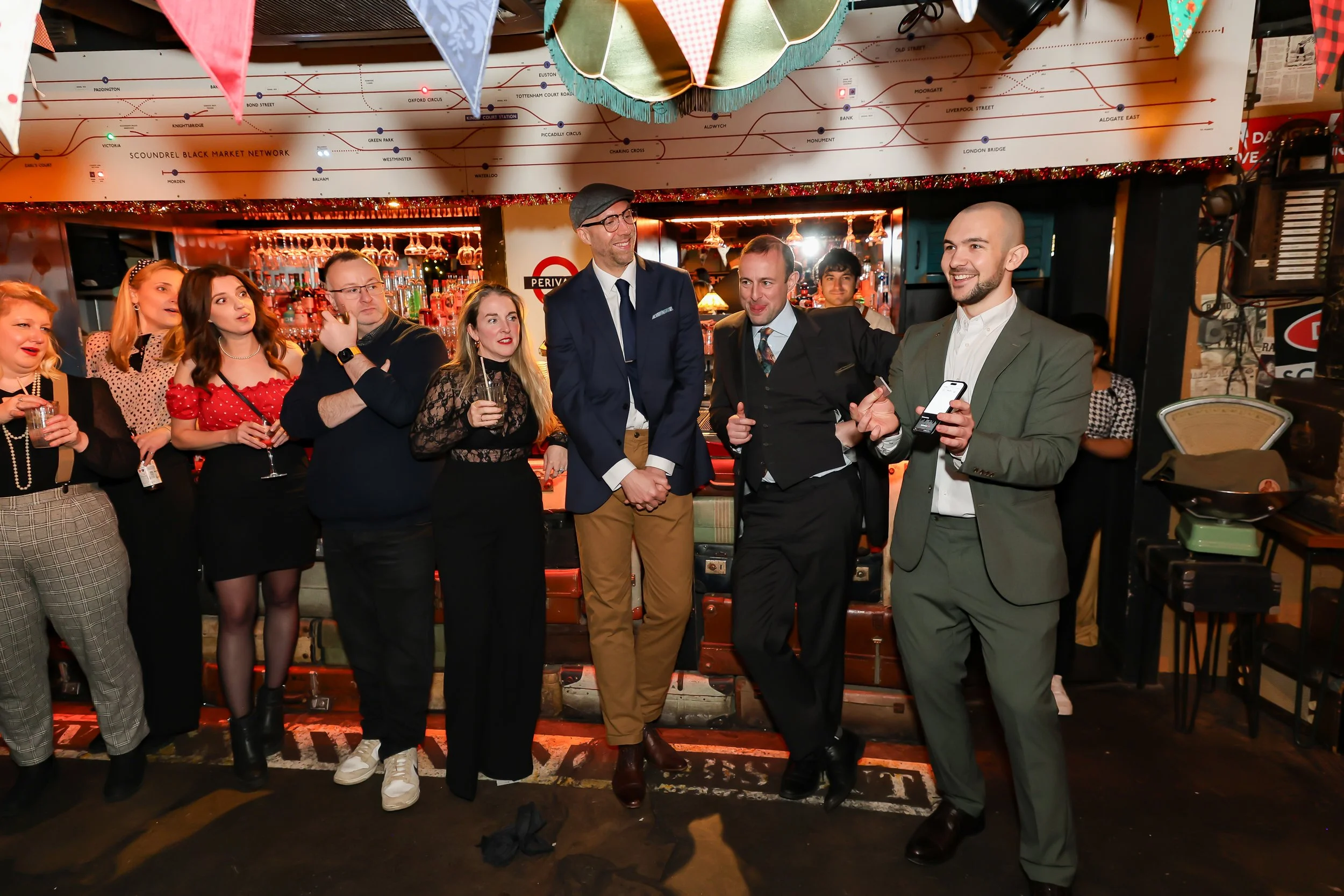 Magician performing walk-around magic for guests at reception.