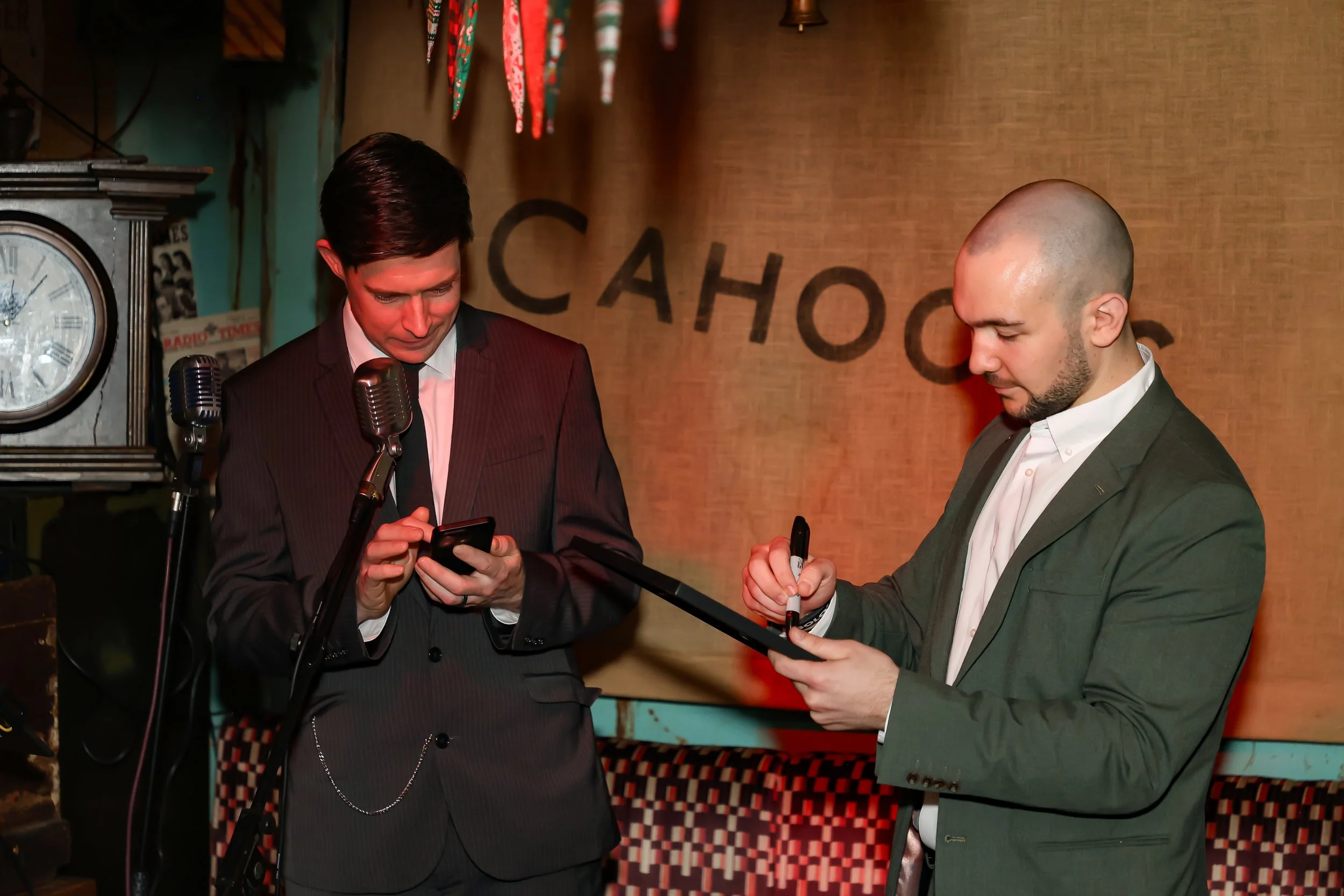 Corporate guests participating in a live interactive magic performance.