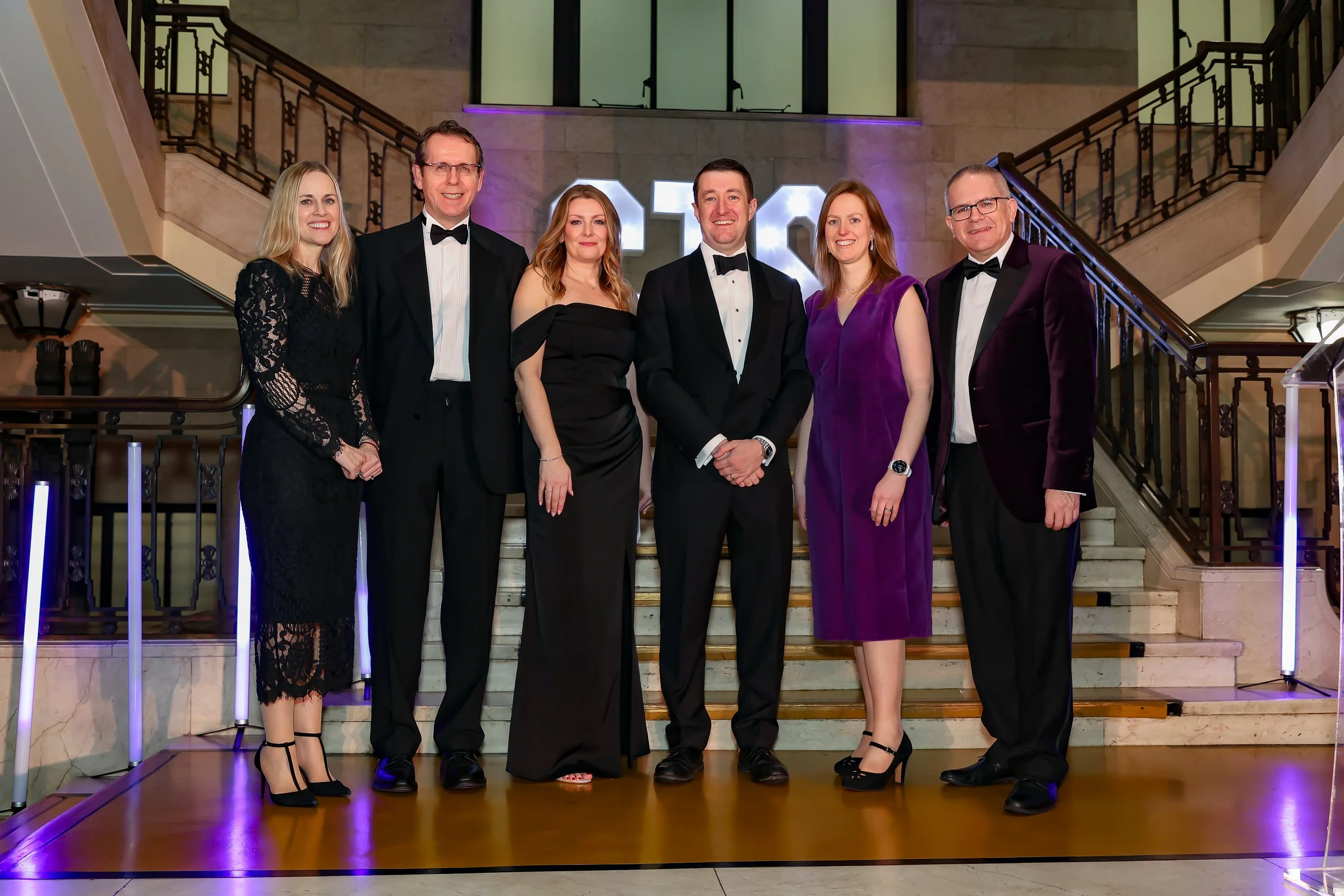 Corporate officials pose before the event starts. 