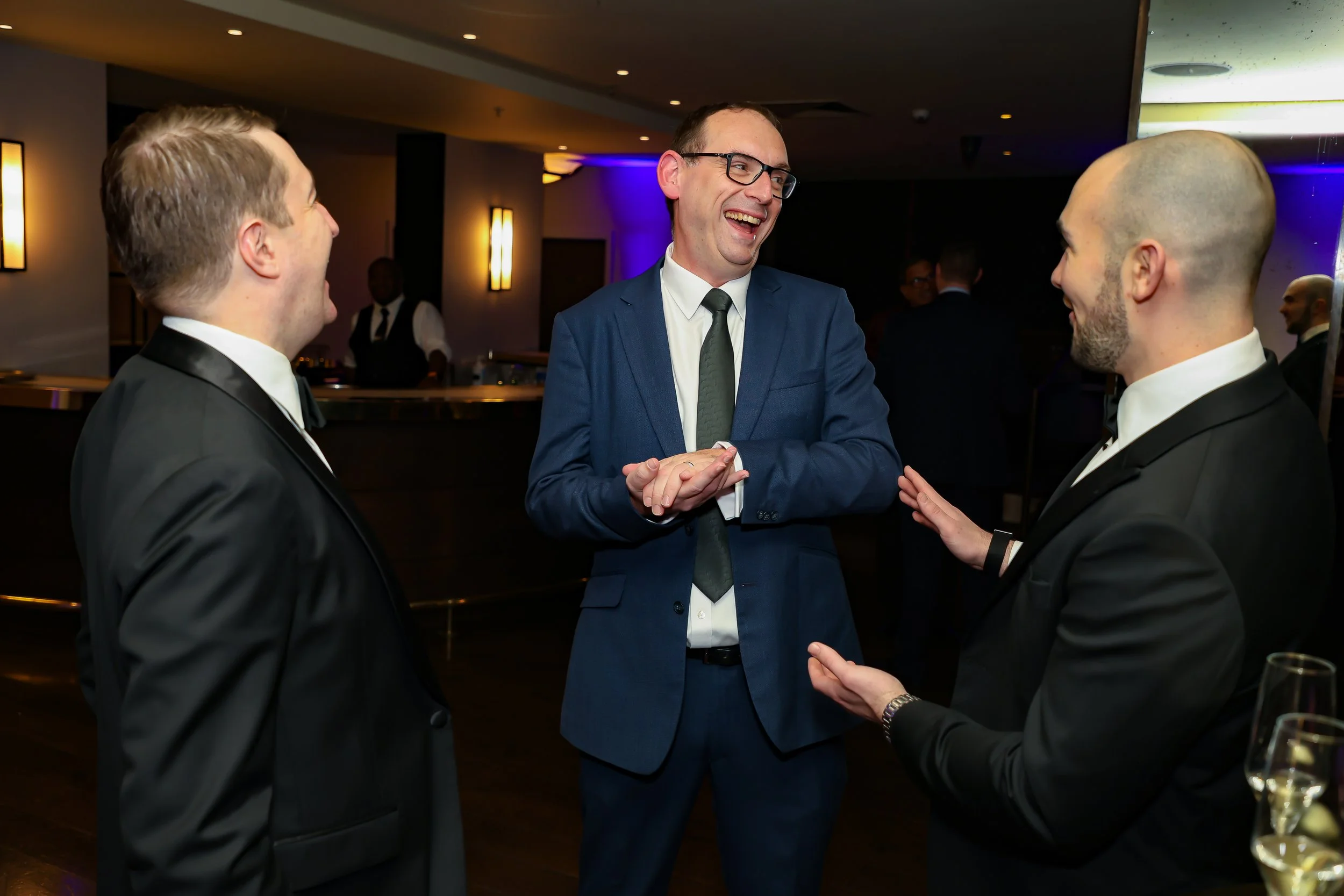 Corporate leaders enjoyed the company of the magician. 