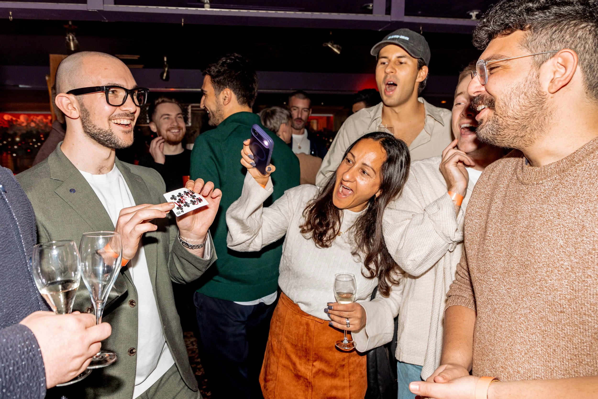 Corporate guest cannot believe magician's walk-around card magic experience.