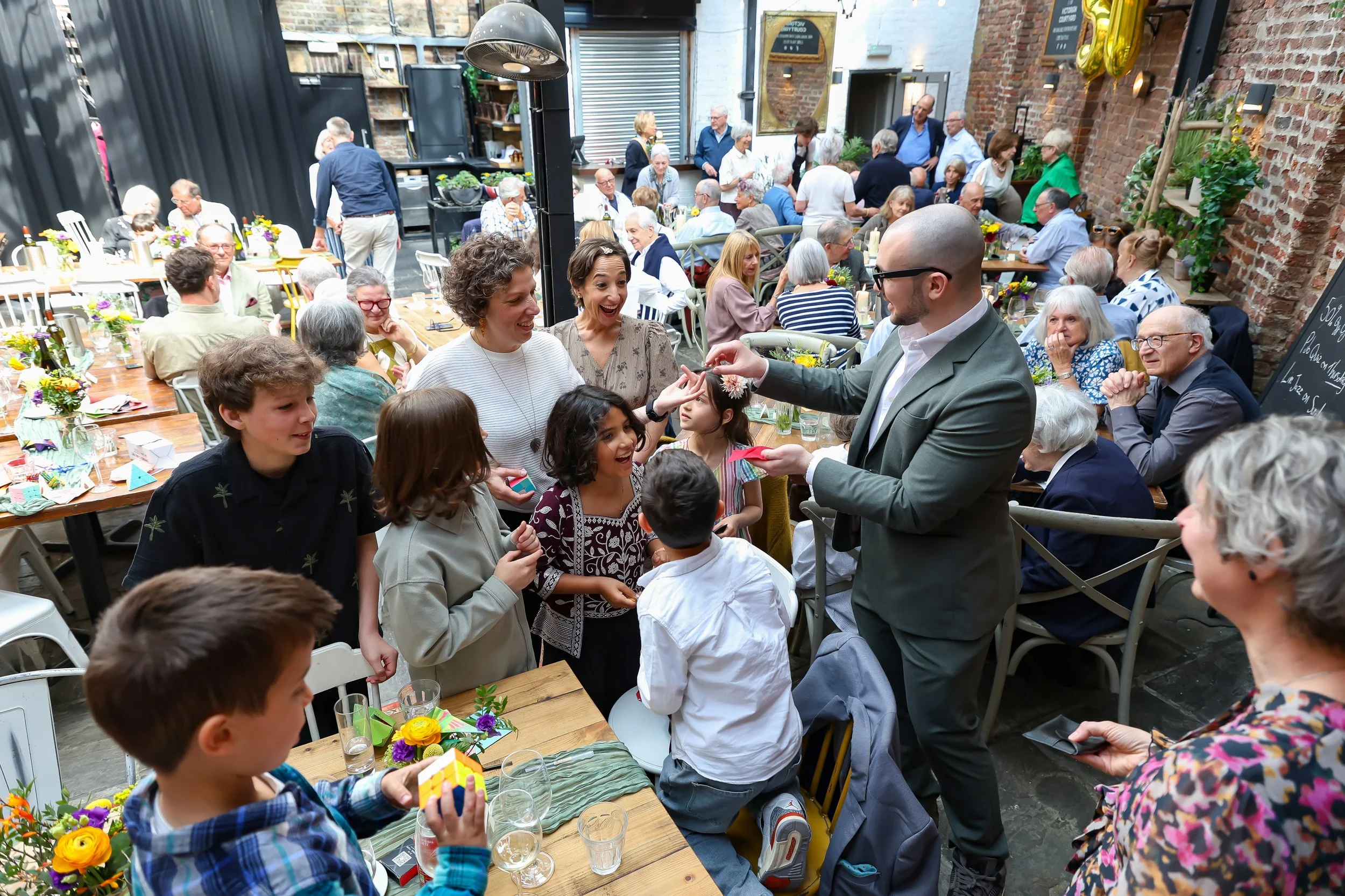 Magical moment with the amazing magician and kids. 2026-May 3 Rhoda & Baruch Golden Wedding Anniversary. 