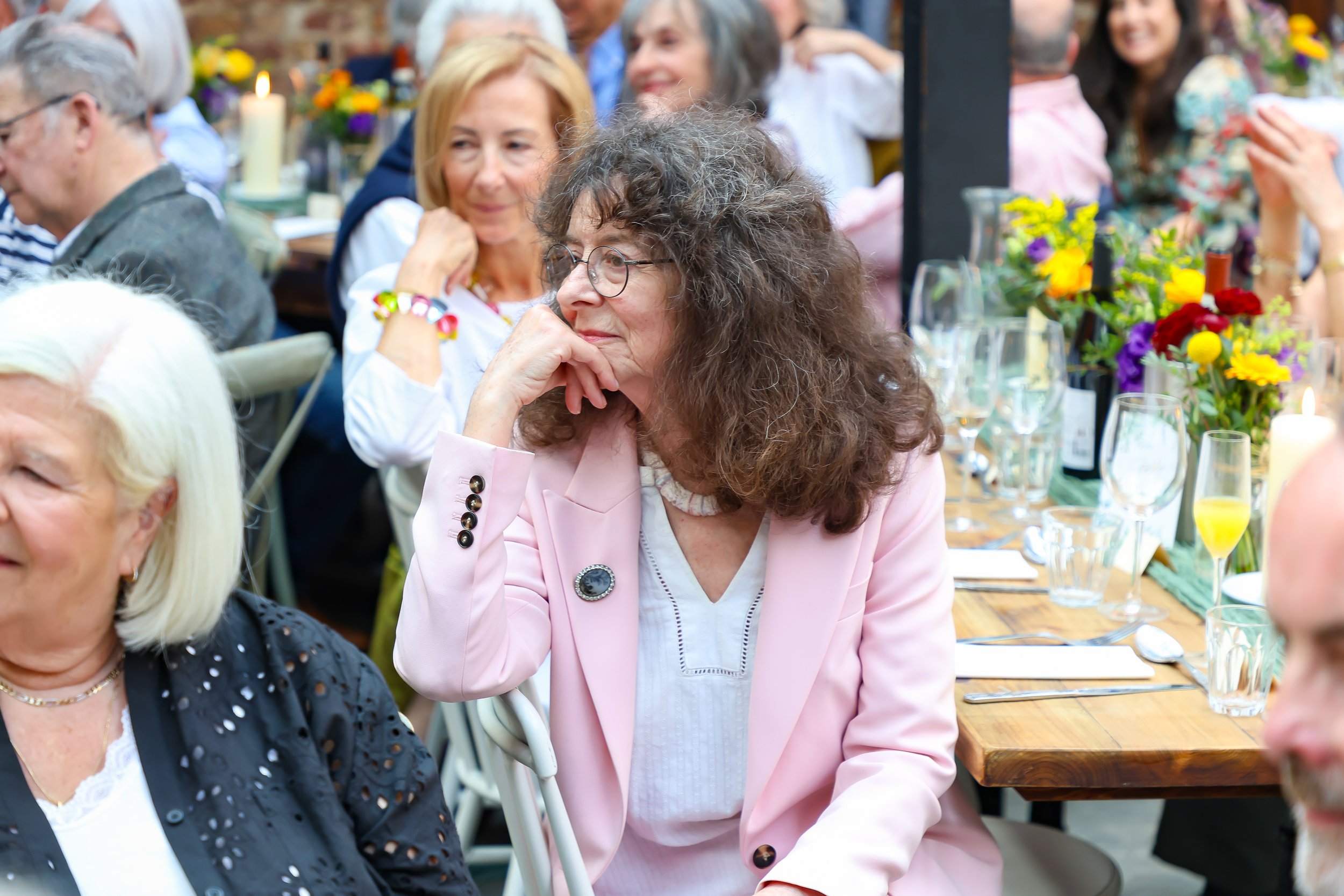 Listens attentively to Baruch on 2026-May 3 Rhoda & Baruch 50th Wedding Anniversary.