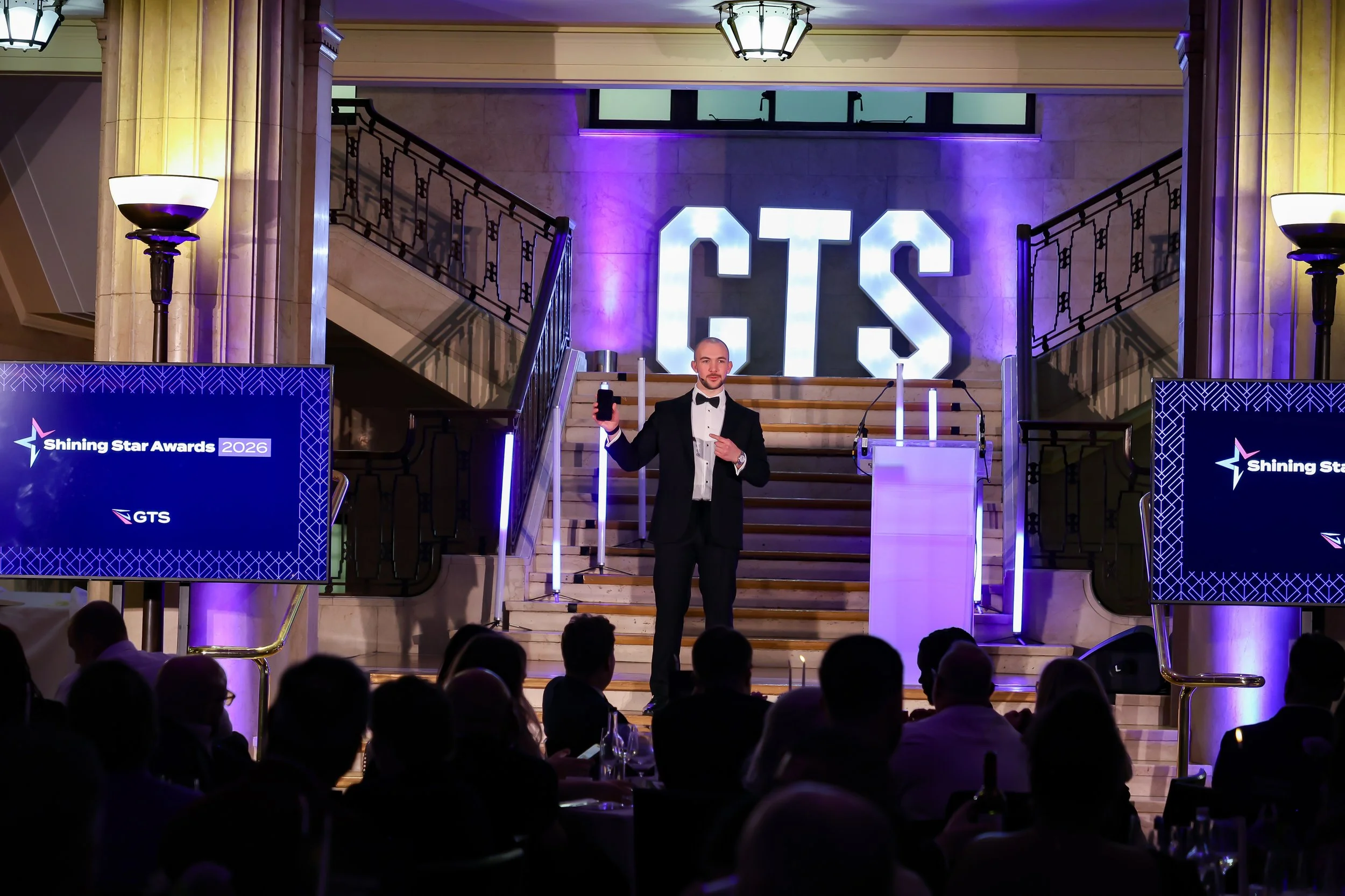 A skilled event host balancing structure and spontaneity to keep the room energised and focused.