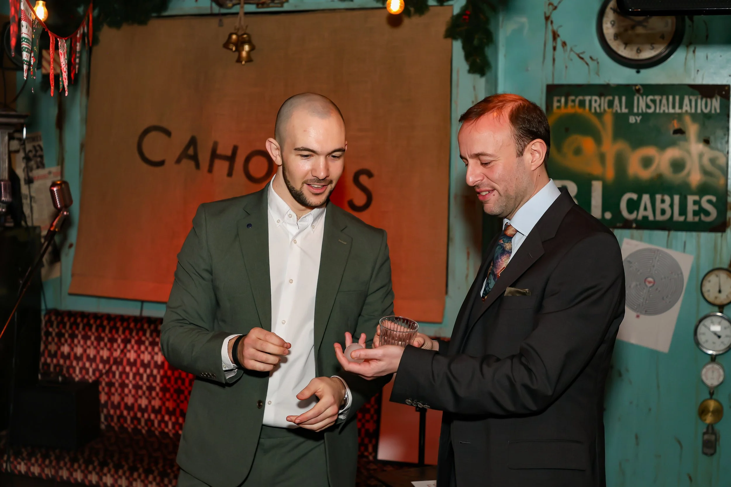 Corporate guests participating in an ice magic performance at the reception.