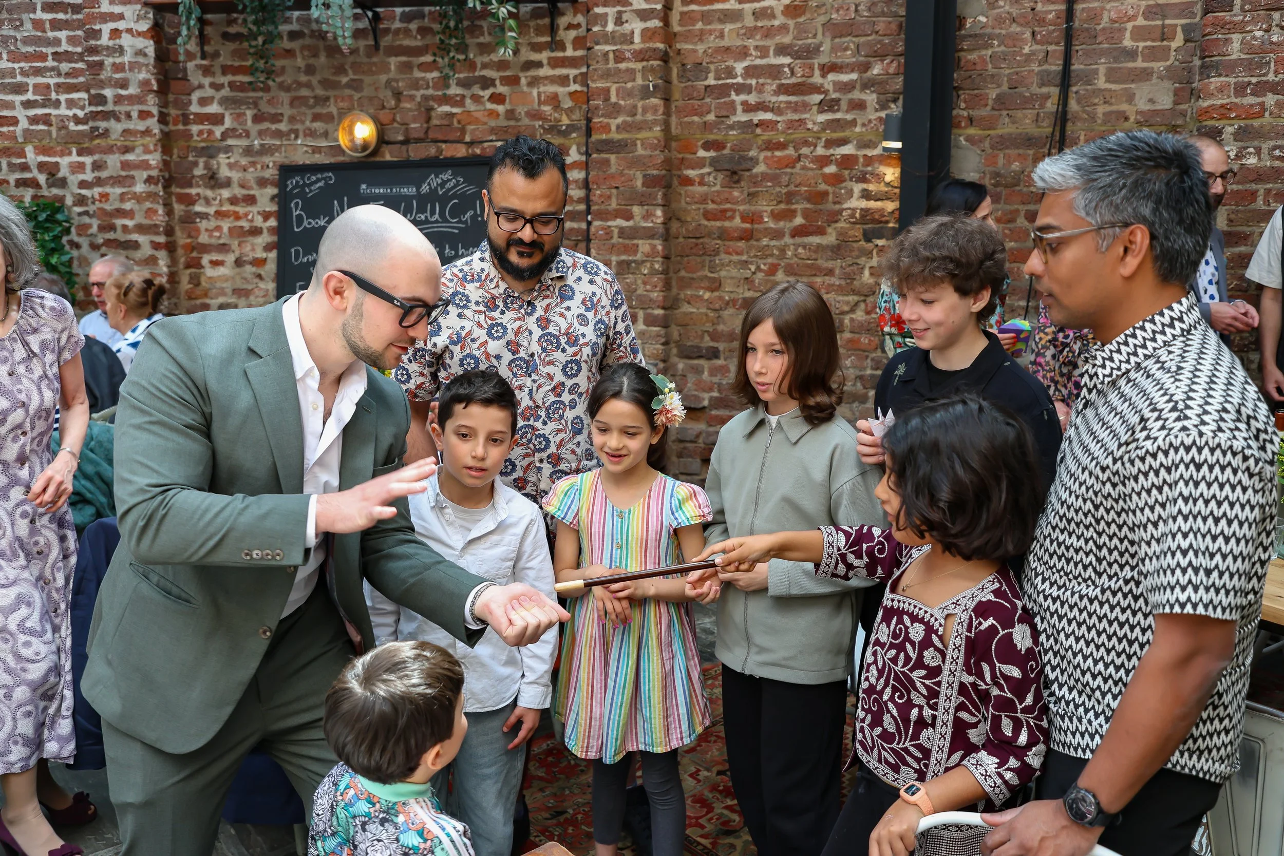 Kids love the moment with the Magician. 2026-May 3 Rhoda & Baruch Golden Wedding Anniversary. 