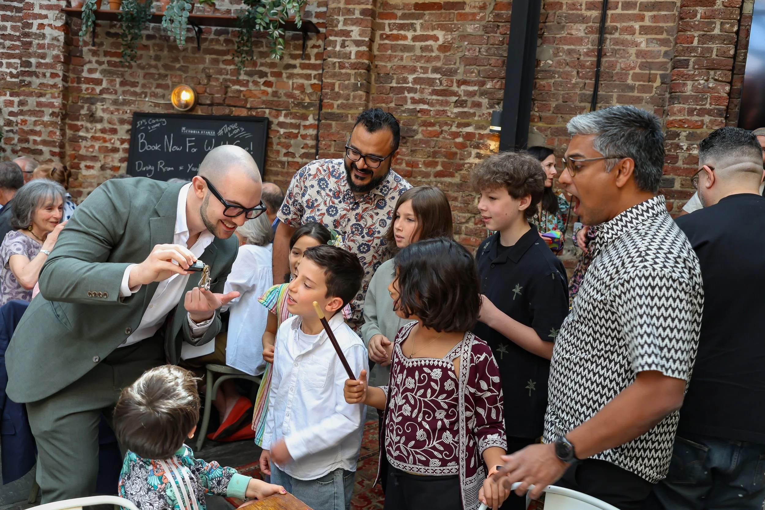 Kids love the moment with the Magician. 2026-May 3 Rhoda & Baruch Golden Wedding Anniversary. 