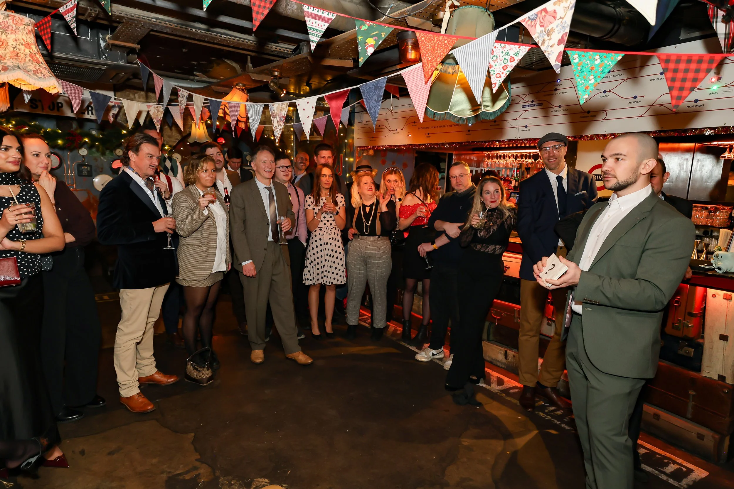 Audience gathered to watch a live magic show at a corporate event in London.