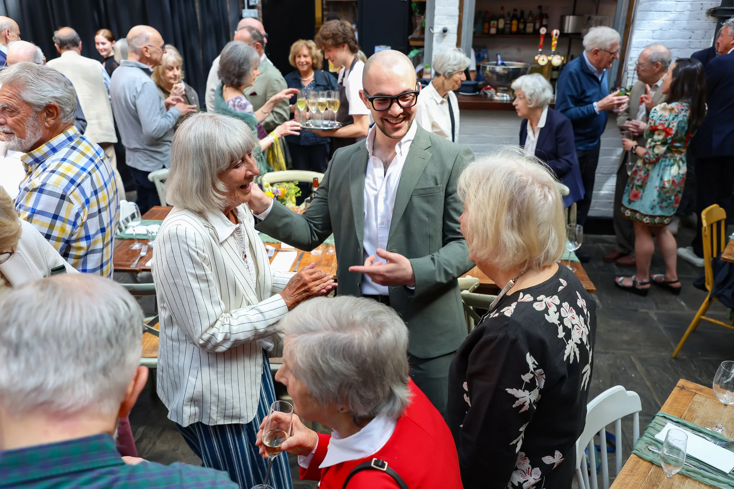 Magician with his card trick. 2026-May 3 Rhoda & Baruch Golden Wedding Anniversary. 