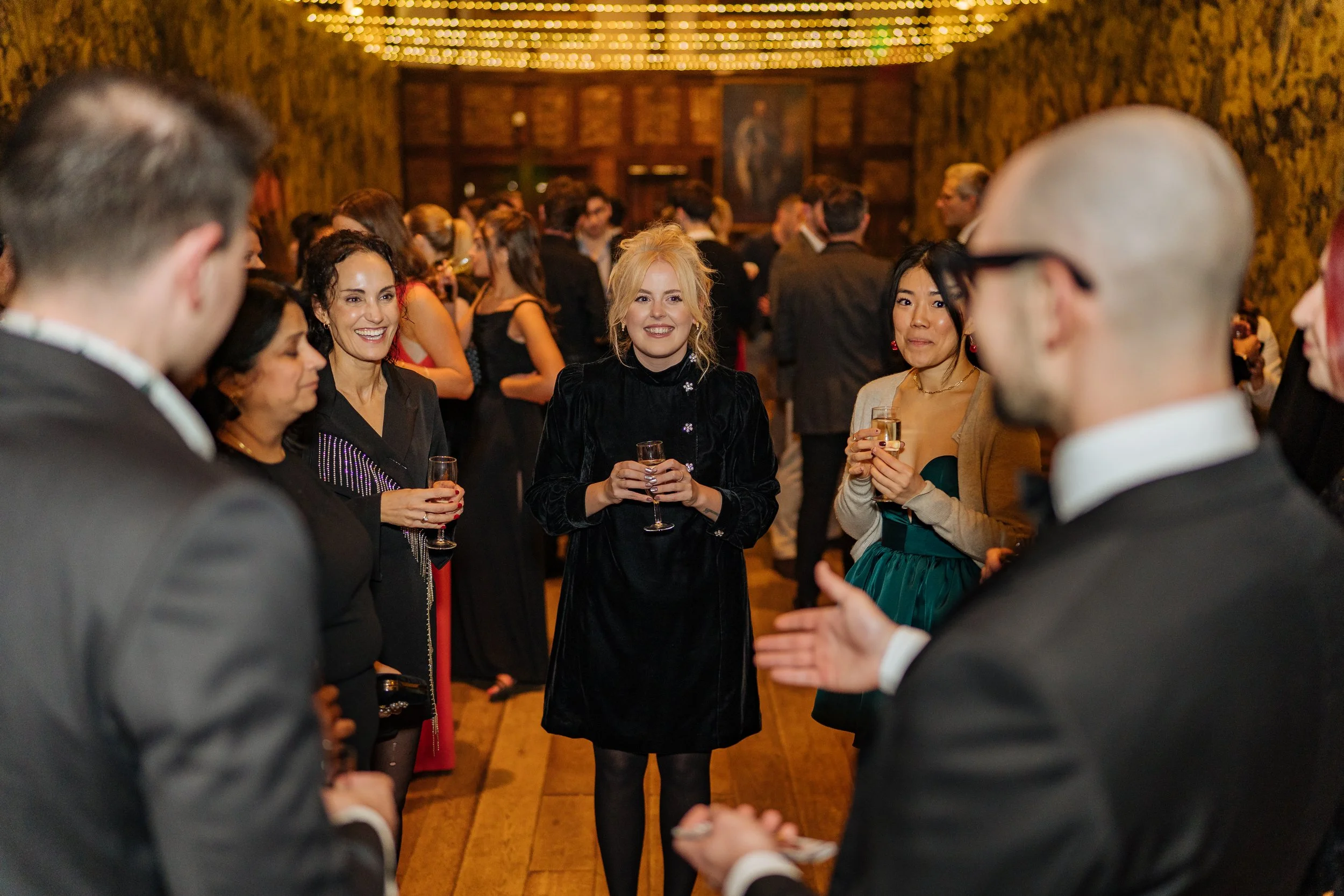 Corporate guests enjoying close-up magic during a formal corporate event.