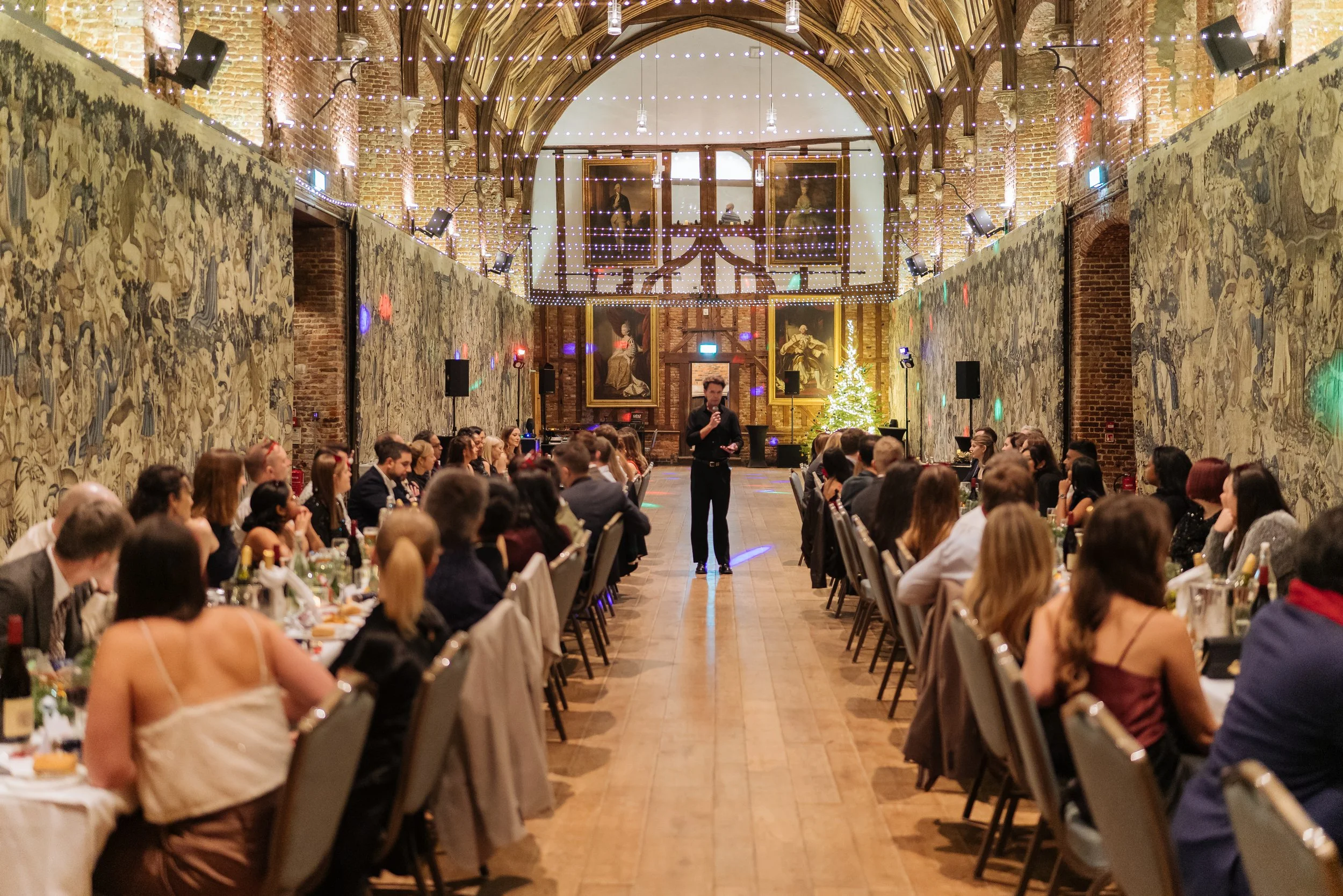 Business professionals attending a formal corporate dinner in London.