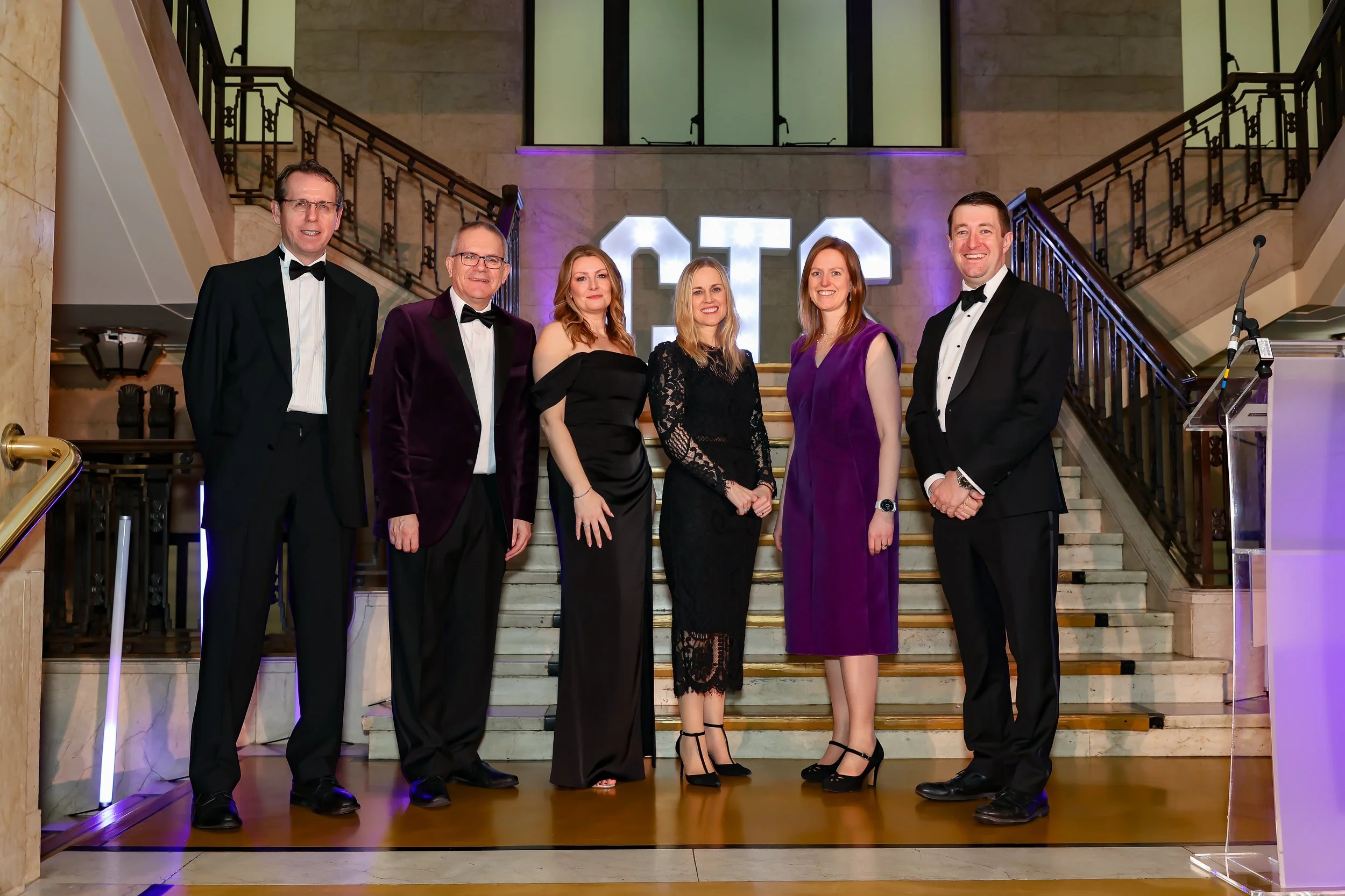 Senior Associates photo op during corporate  event. 