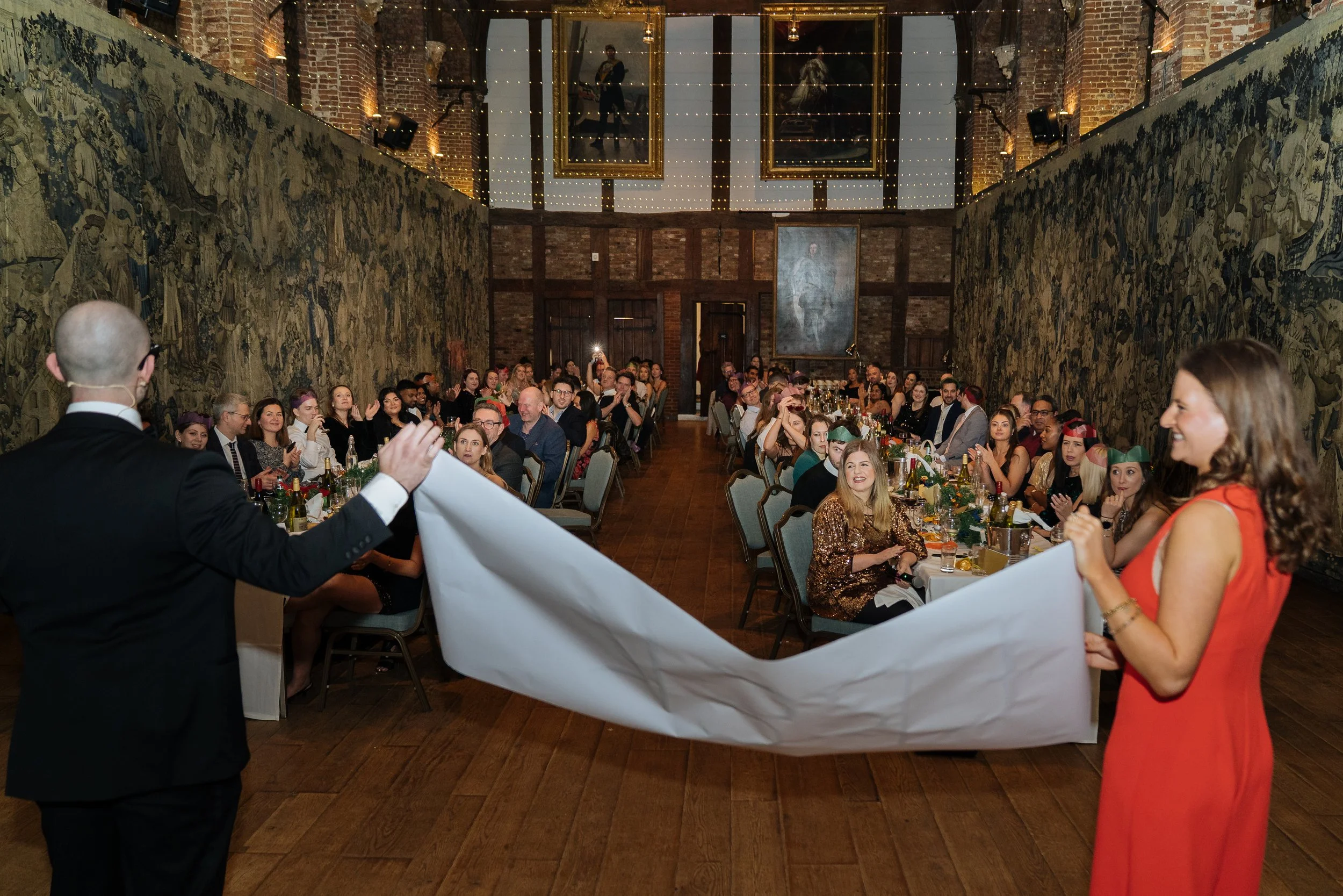 Guest taking part in a live magic act, a hands-on moment with the magician.