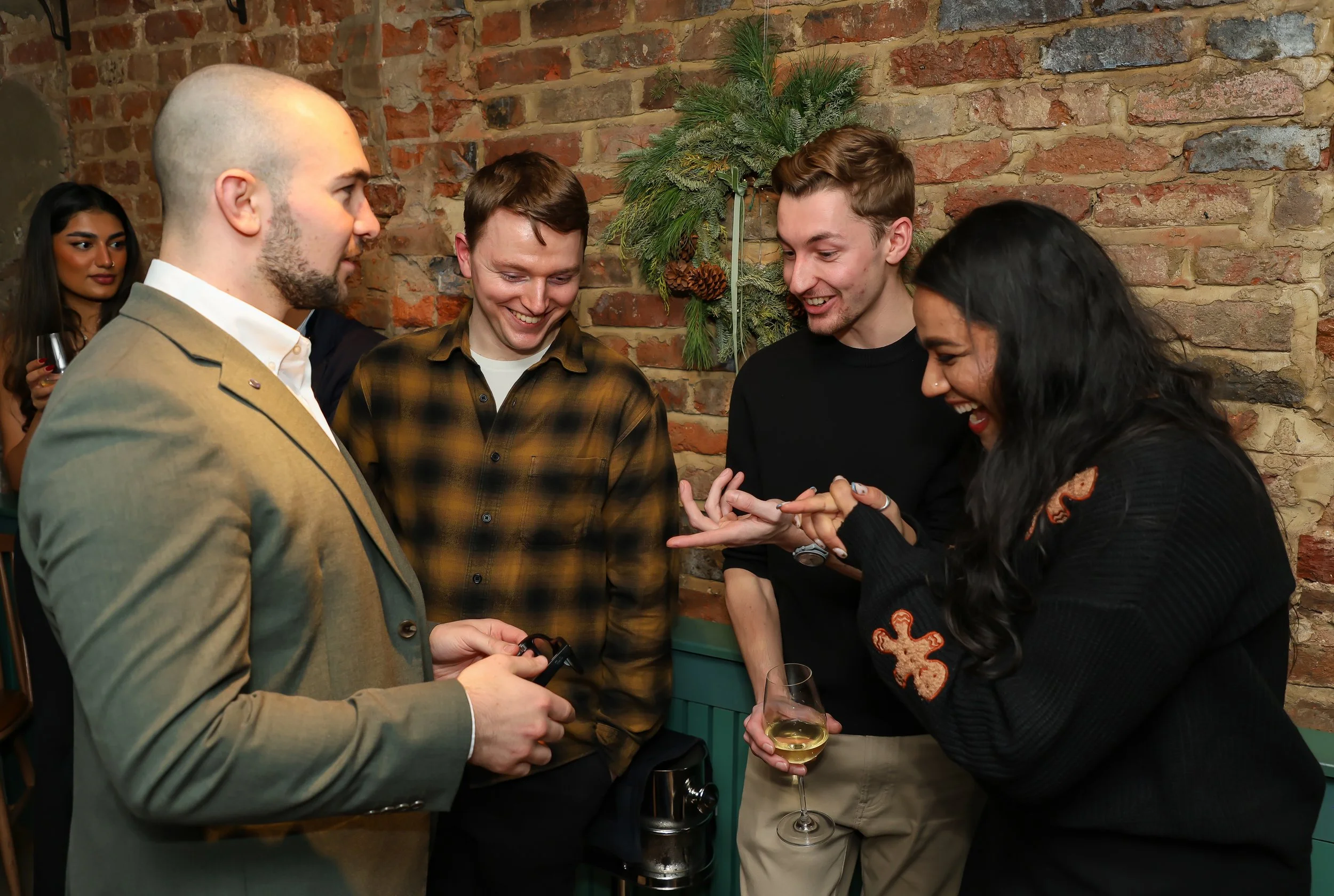 Guests experiencing laughter and surprise through interactive close-up magic.