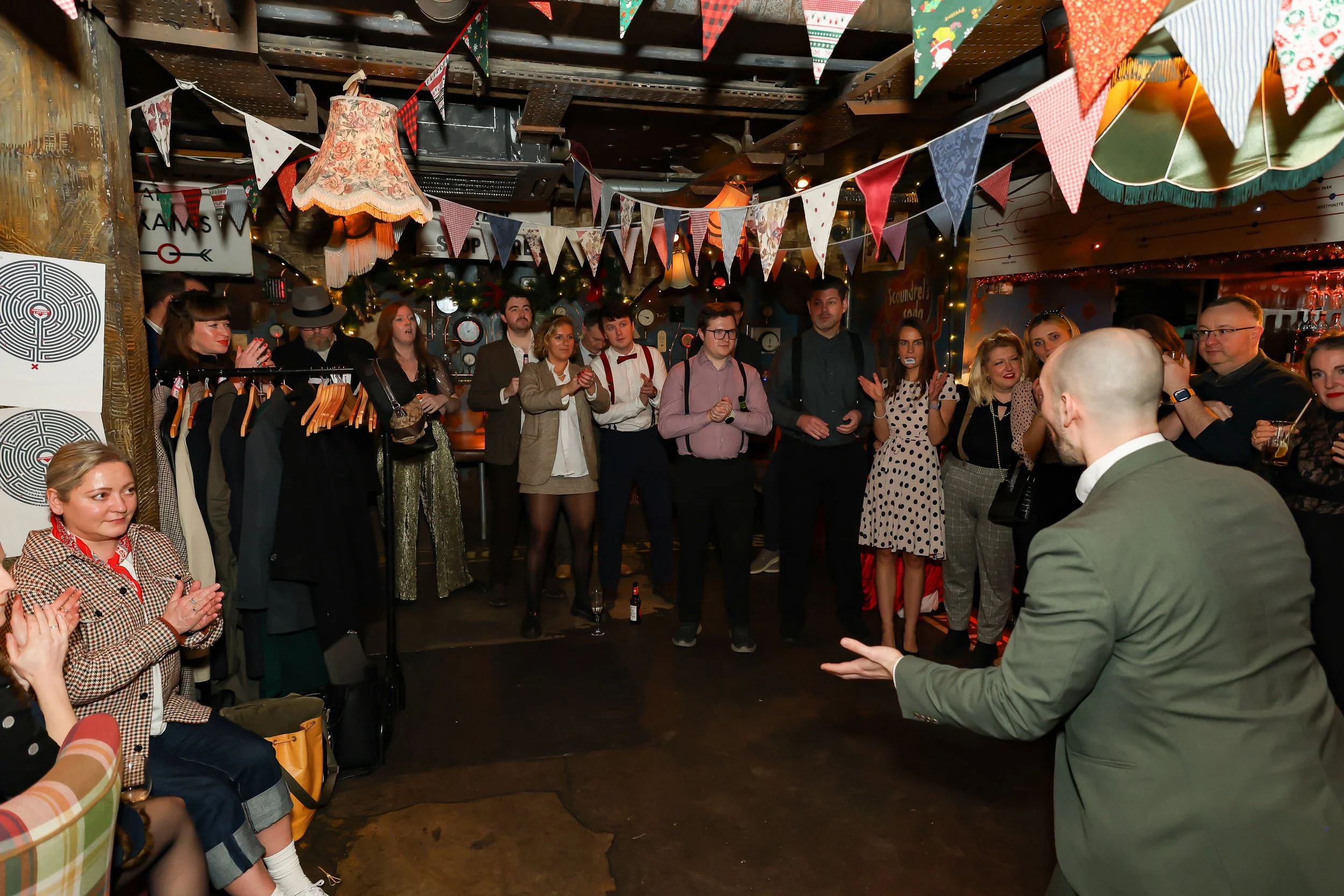 Magician performing walk-around magic for guests at reception.