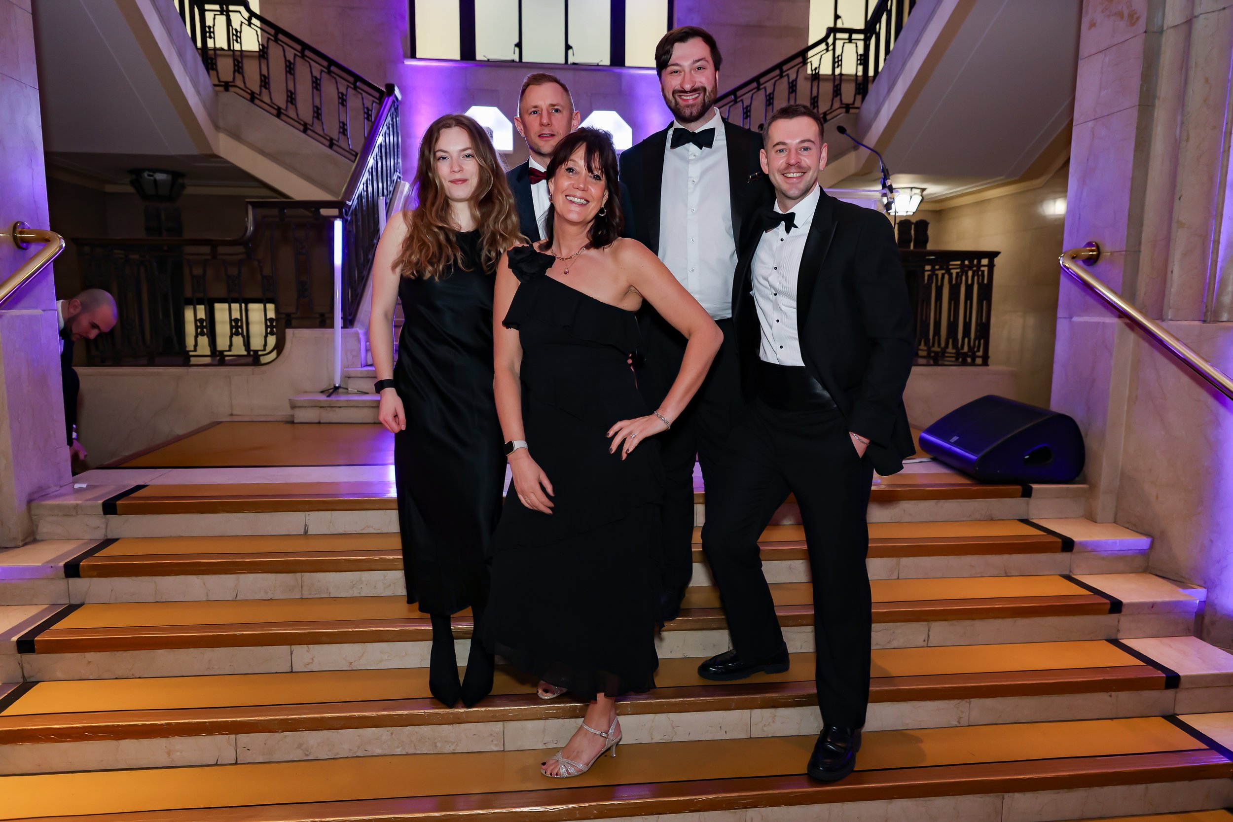 Corporate employees poses while waiting for the event to start. 