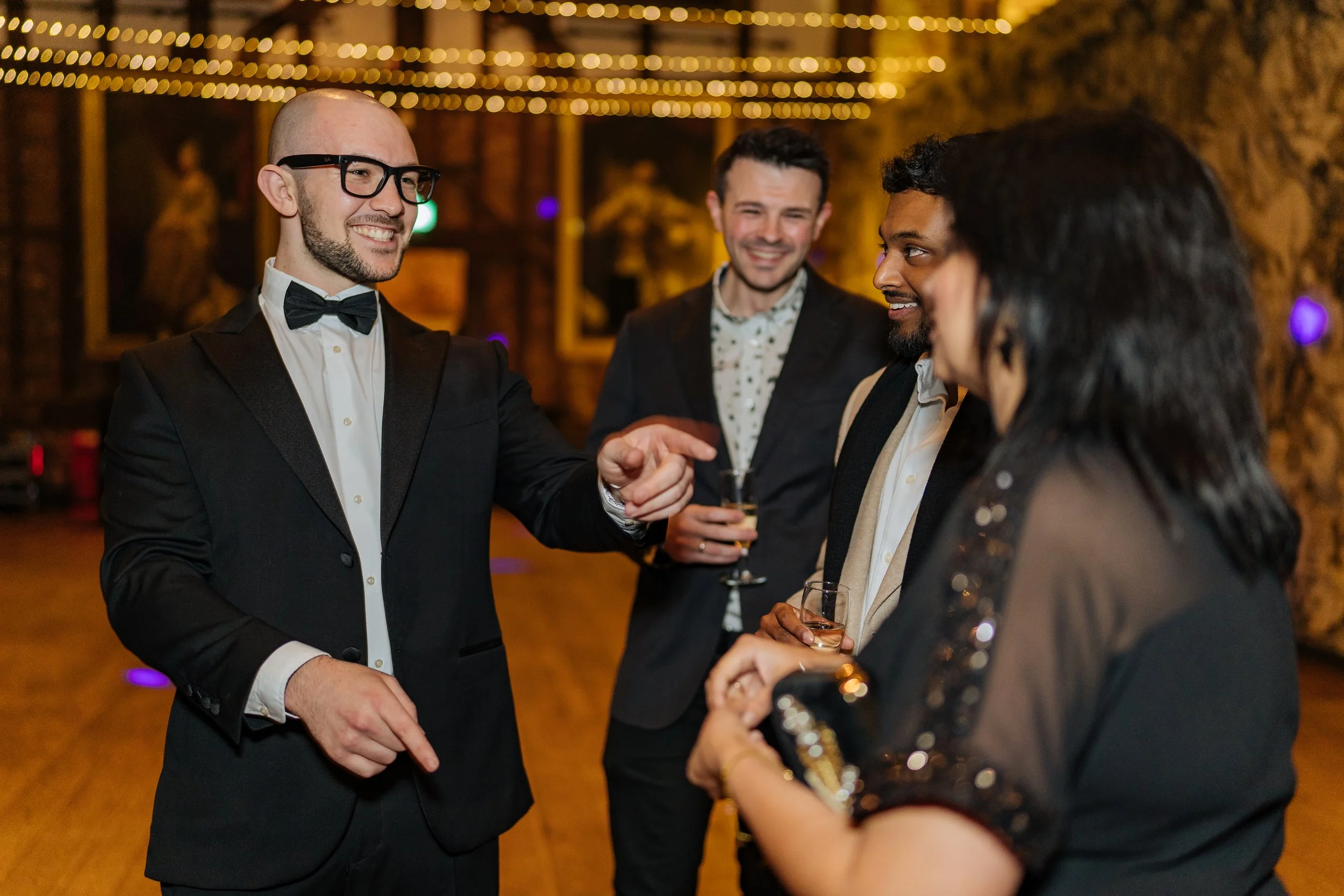 Corporate guests enjoying close-up magic during a formal corporate event.