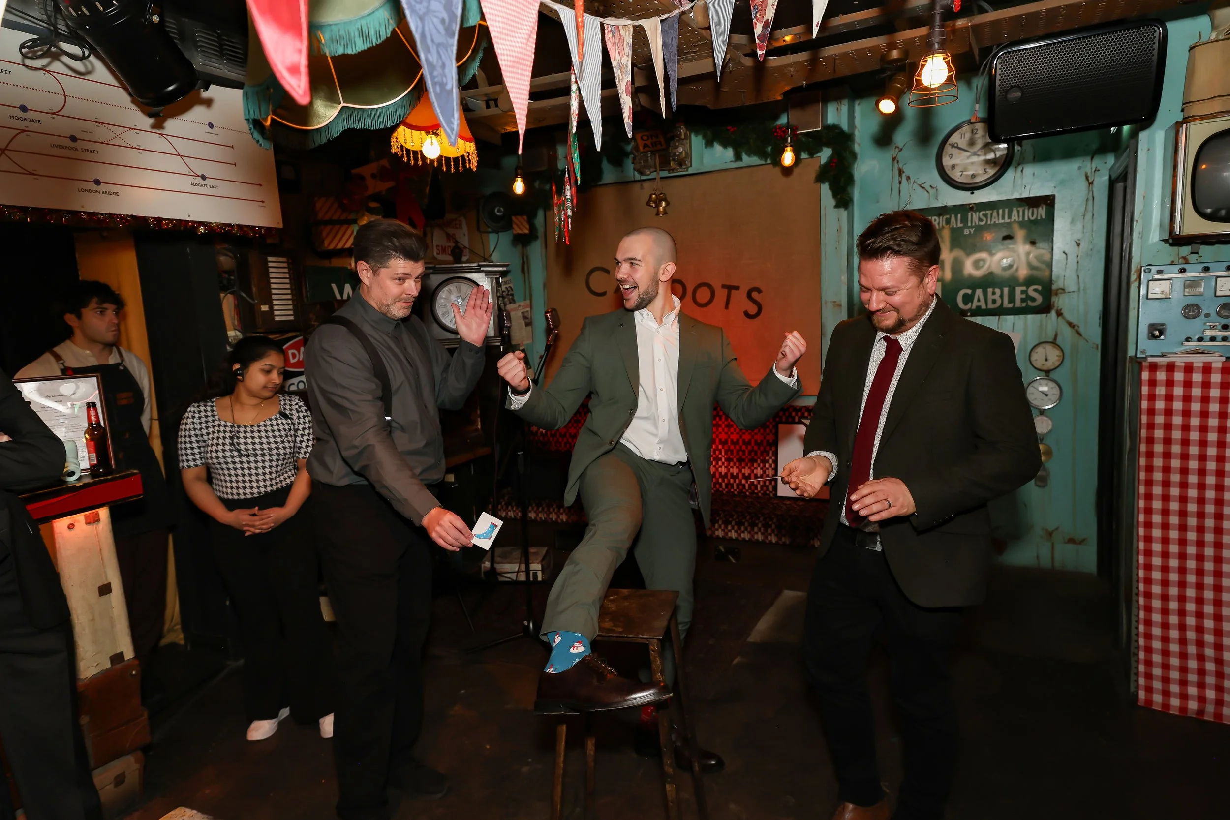 Guests enjoying hands-on interaction during a live magic show.