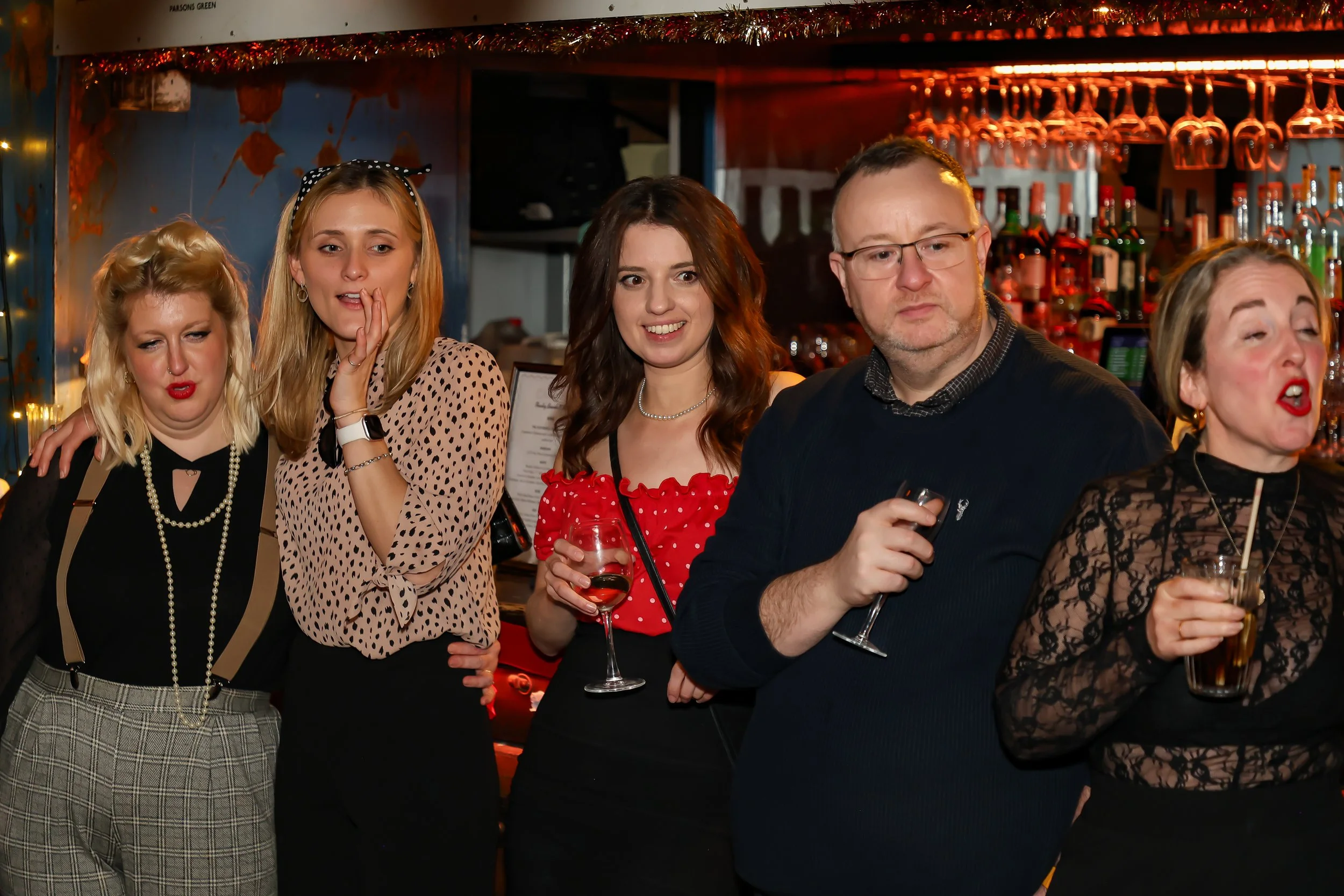 Magician performing walk-around magic for guests at reception.