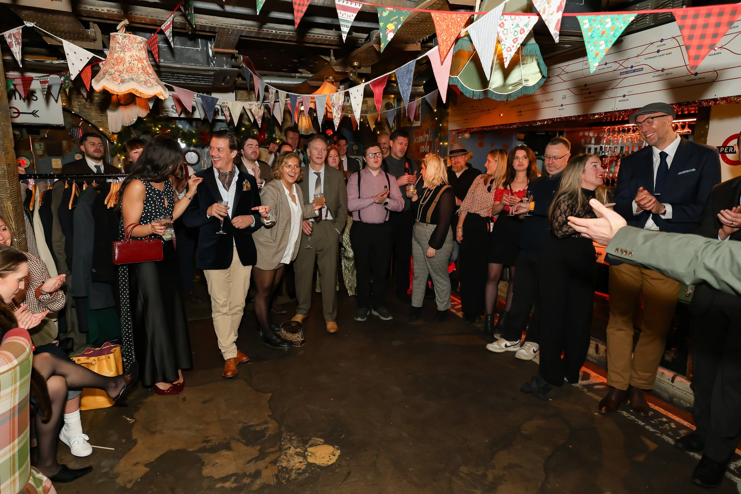 Audience gathered to watch a live magic show at a corporate event in London.