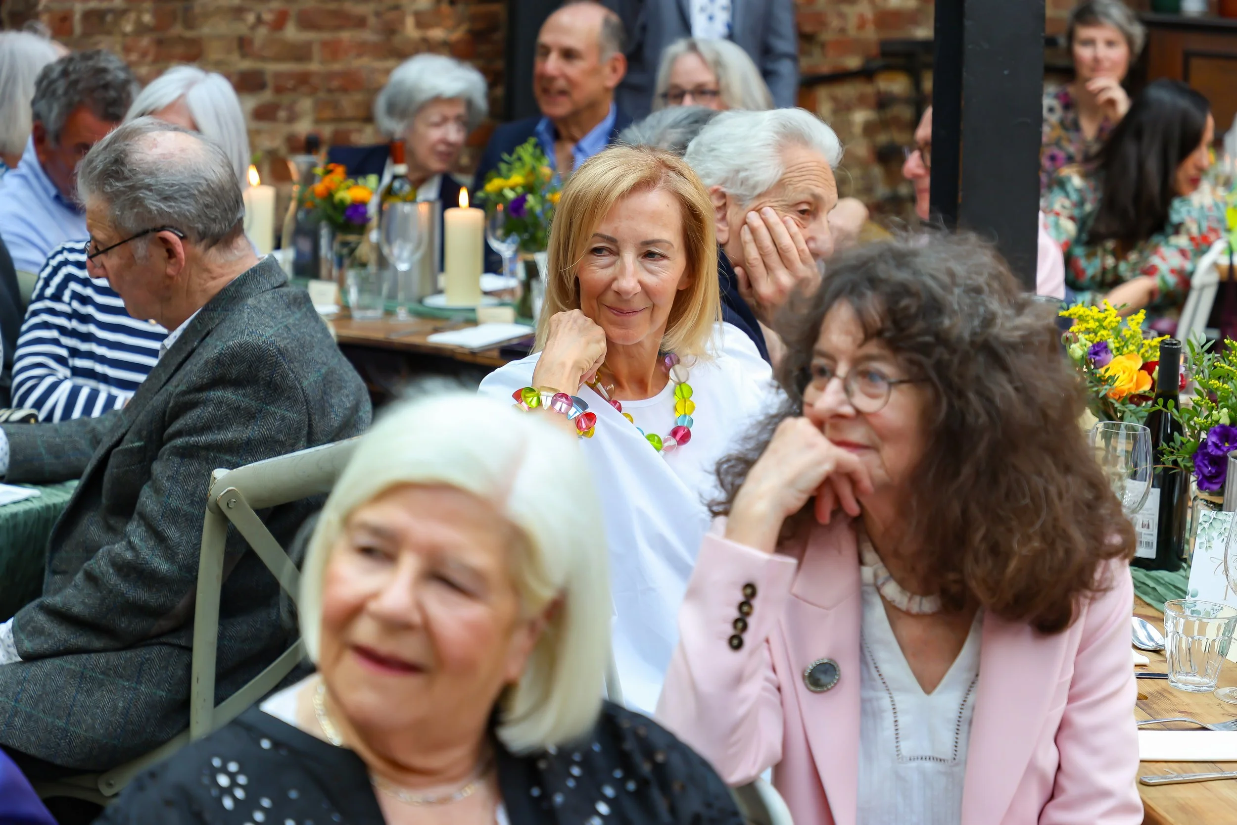 Listens attentively to Baruch on 2026-May 3 Rhoda & Baruch 50th Wedding Anniversary.