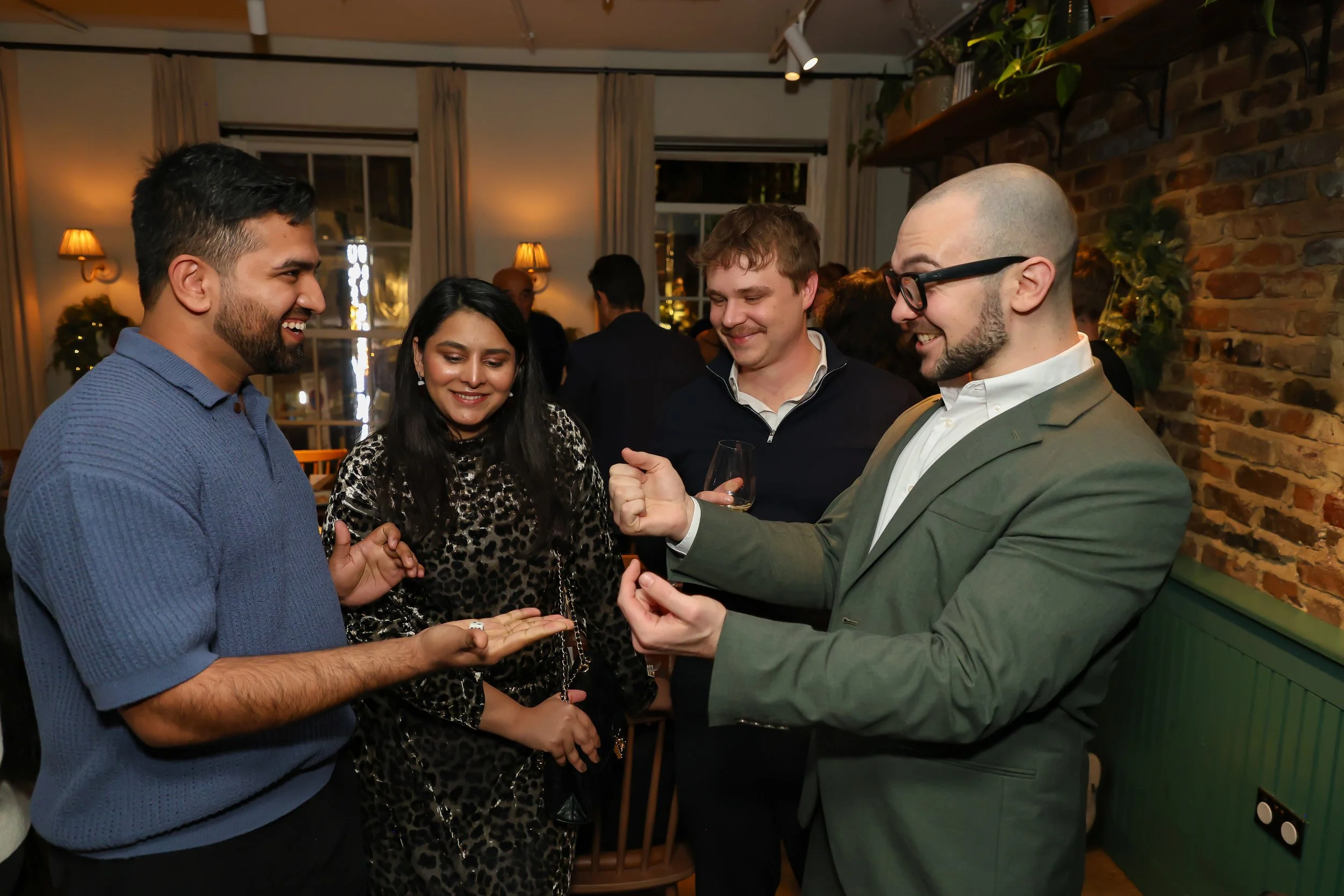 Interactive close-up magic delivering memorable moments of laughter for a small group during event reception. 