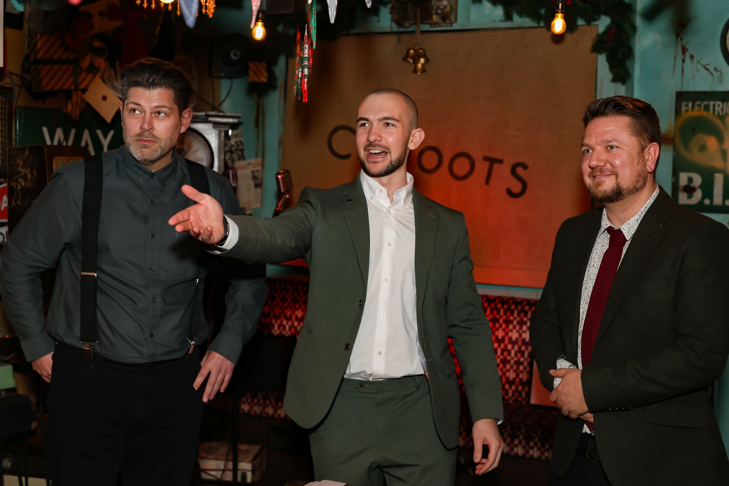 Magician performing walk-around magic for guests at reception.