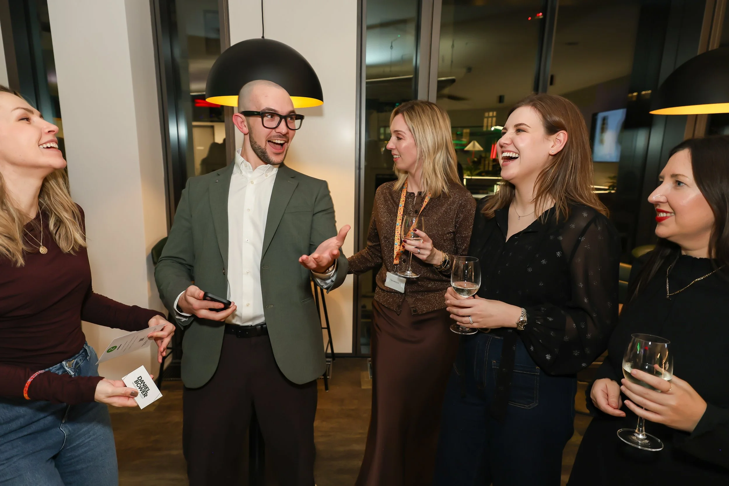 Close-up card magic leaves corporate guests amazed.