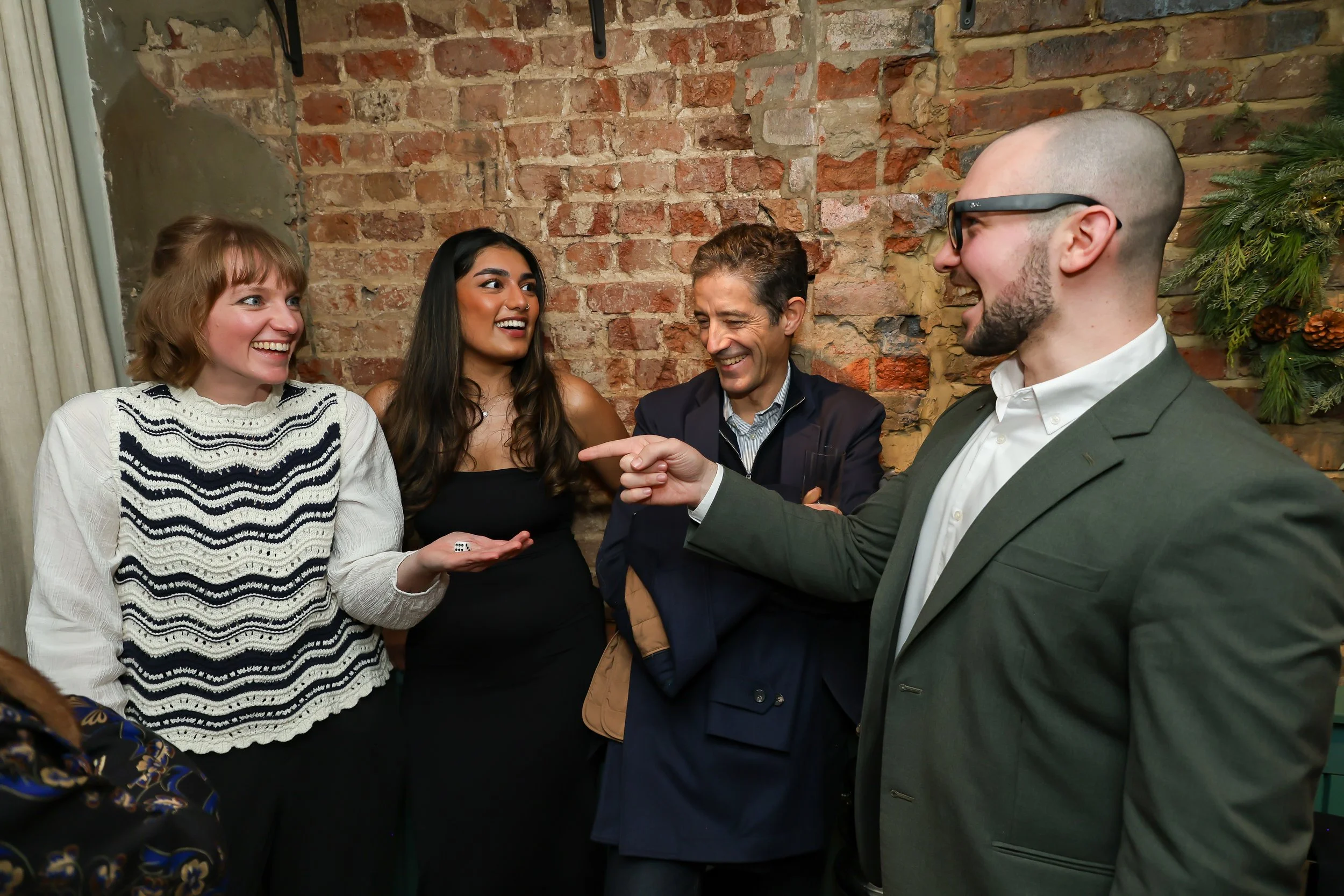 Magician wrapping up an engaging corporate party surrounded by happy guests.