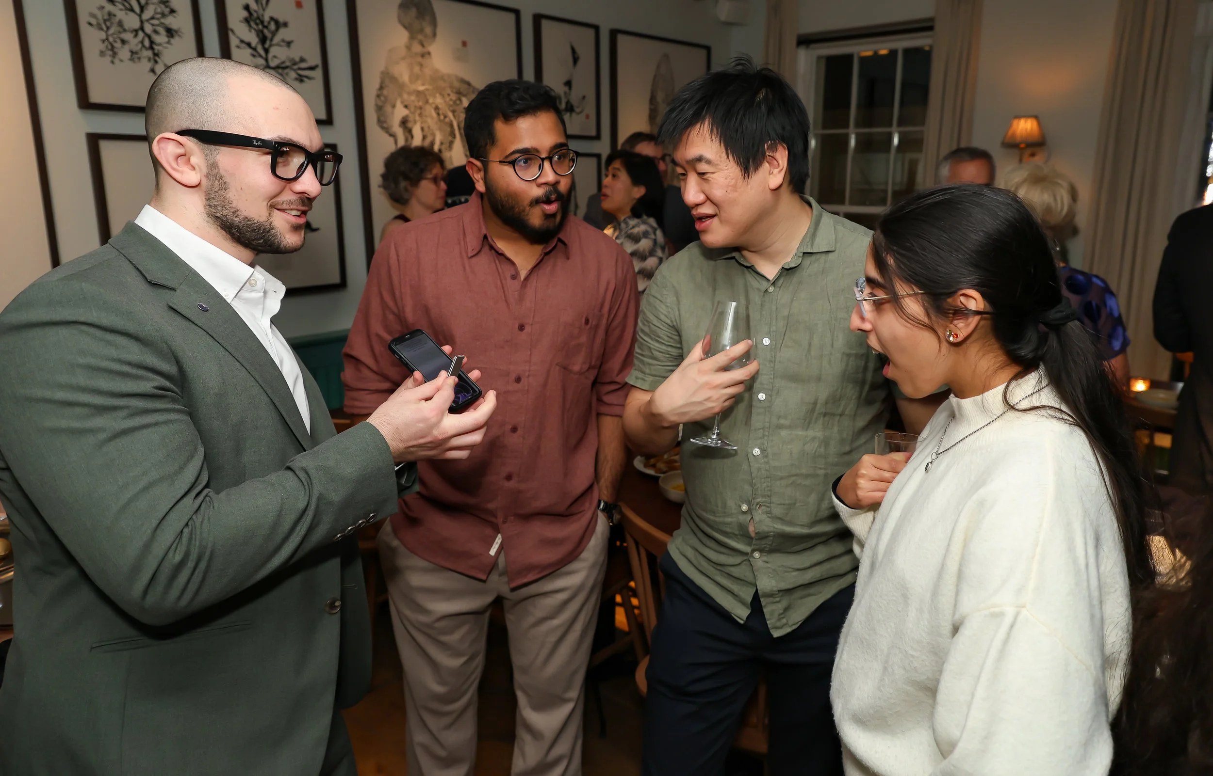 Guests reacting with amazement during a magic performance at a London corporate event.