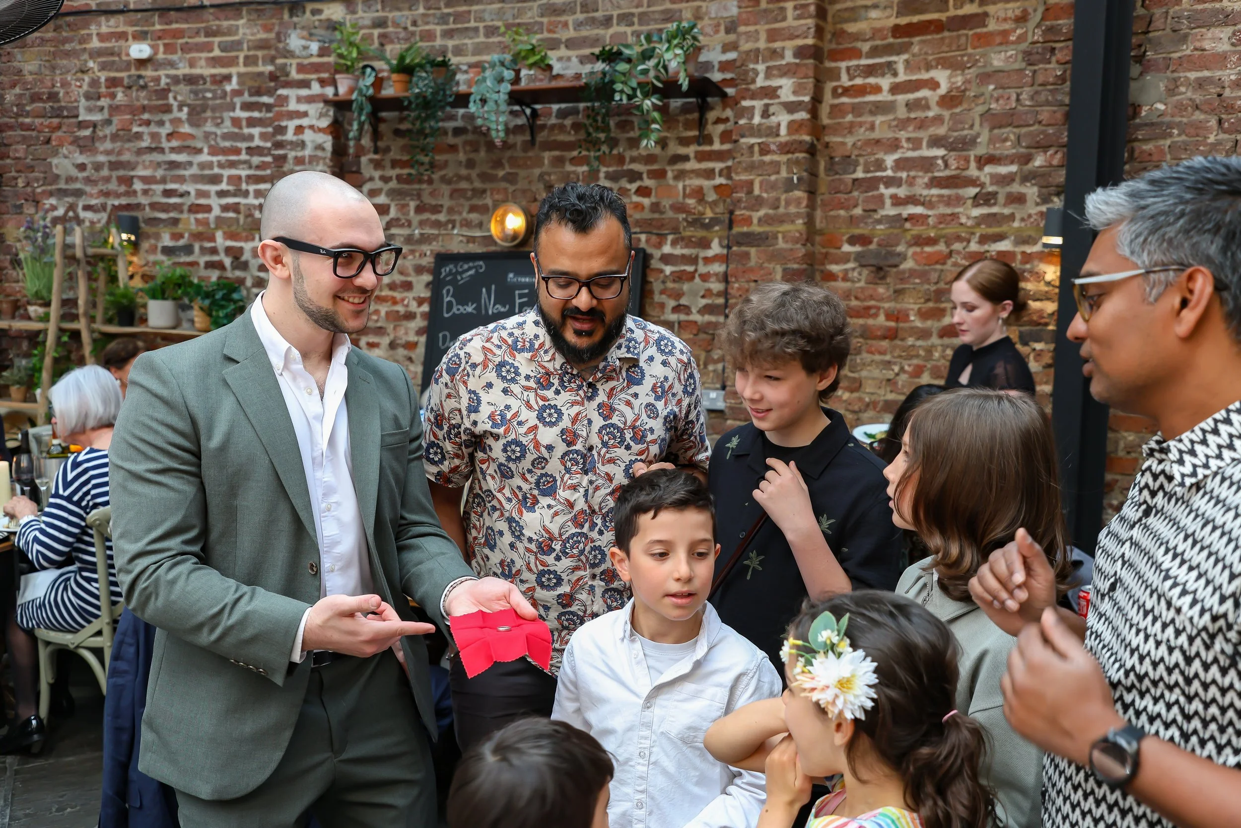 Kids love the moment with the Magician. 2026-May 3 Rhoda & Baruch Golden Wedding Anniversary. 