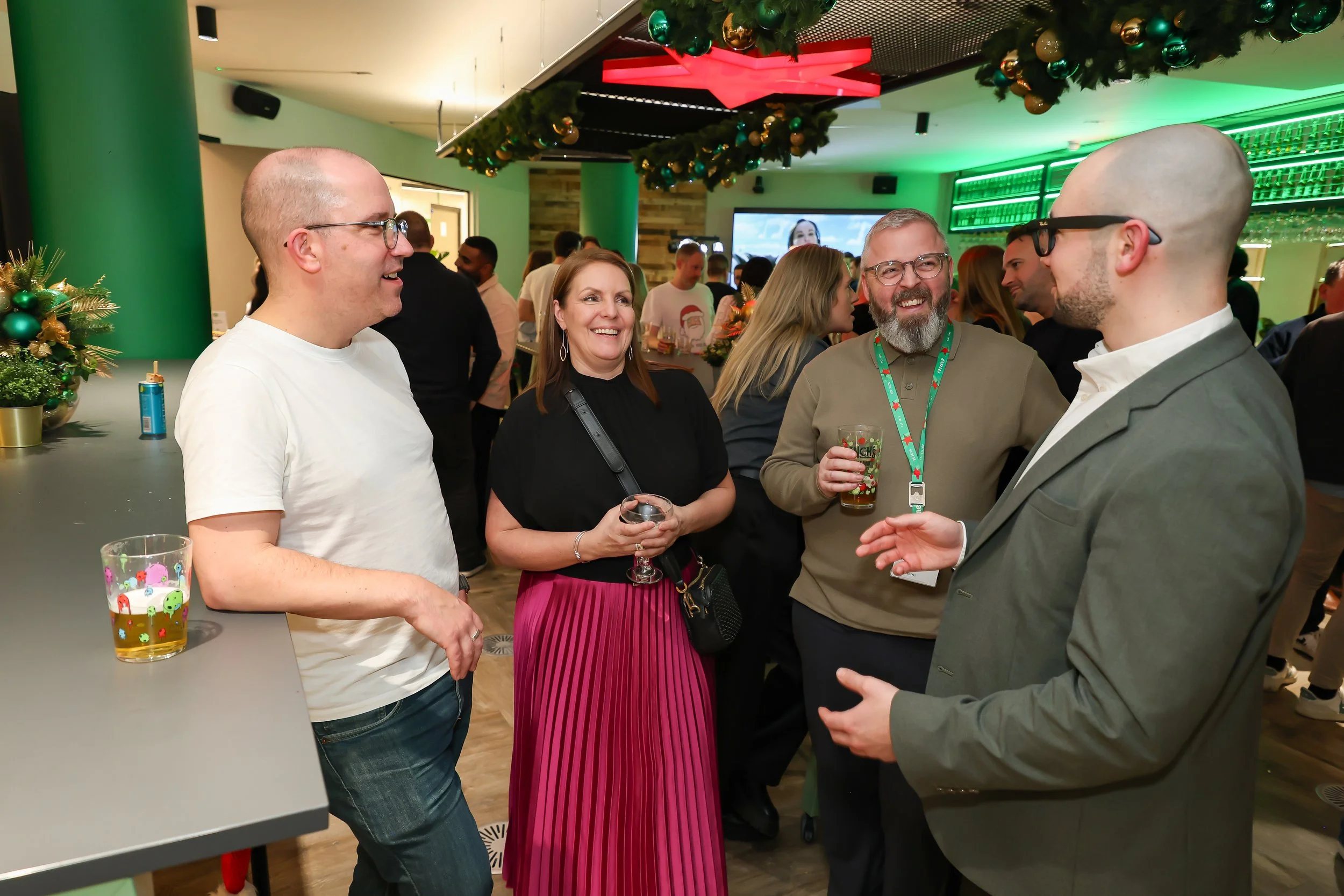 Christmas party entertainment with interactive magic and laughter among corporate colleagues.