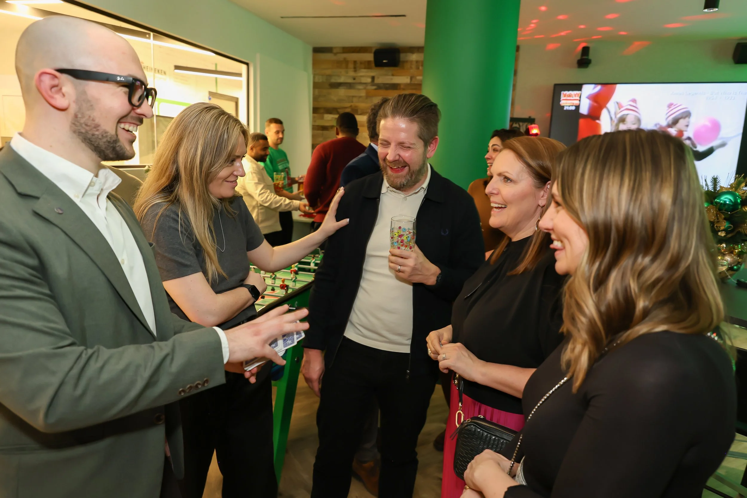 Playful close-up magic engages guests during a corporate reception.