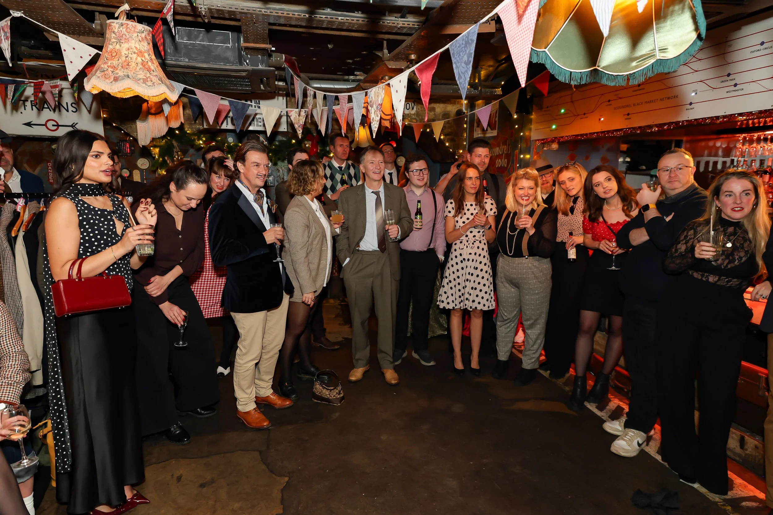 Magician performing walk-around magic for guests at reception.