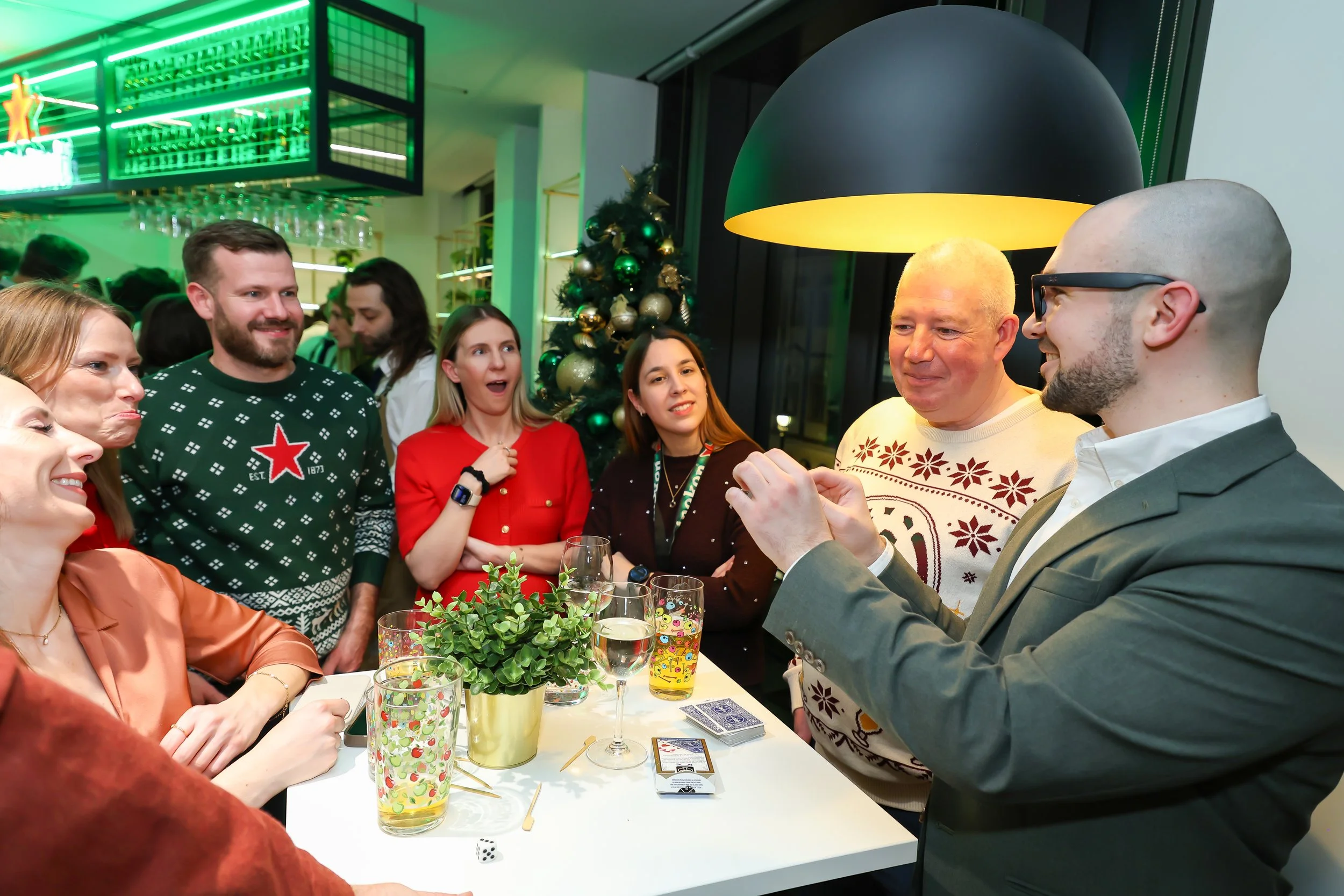 Interactive side-table magic performance at a corporate reception by a London magician.