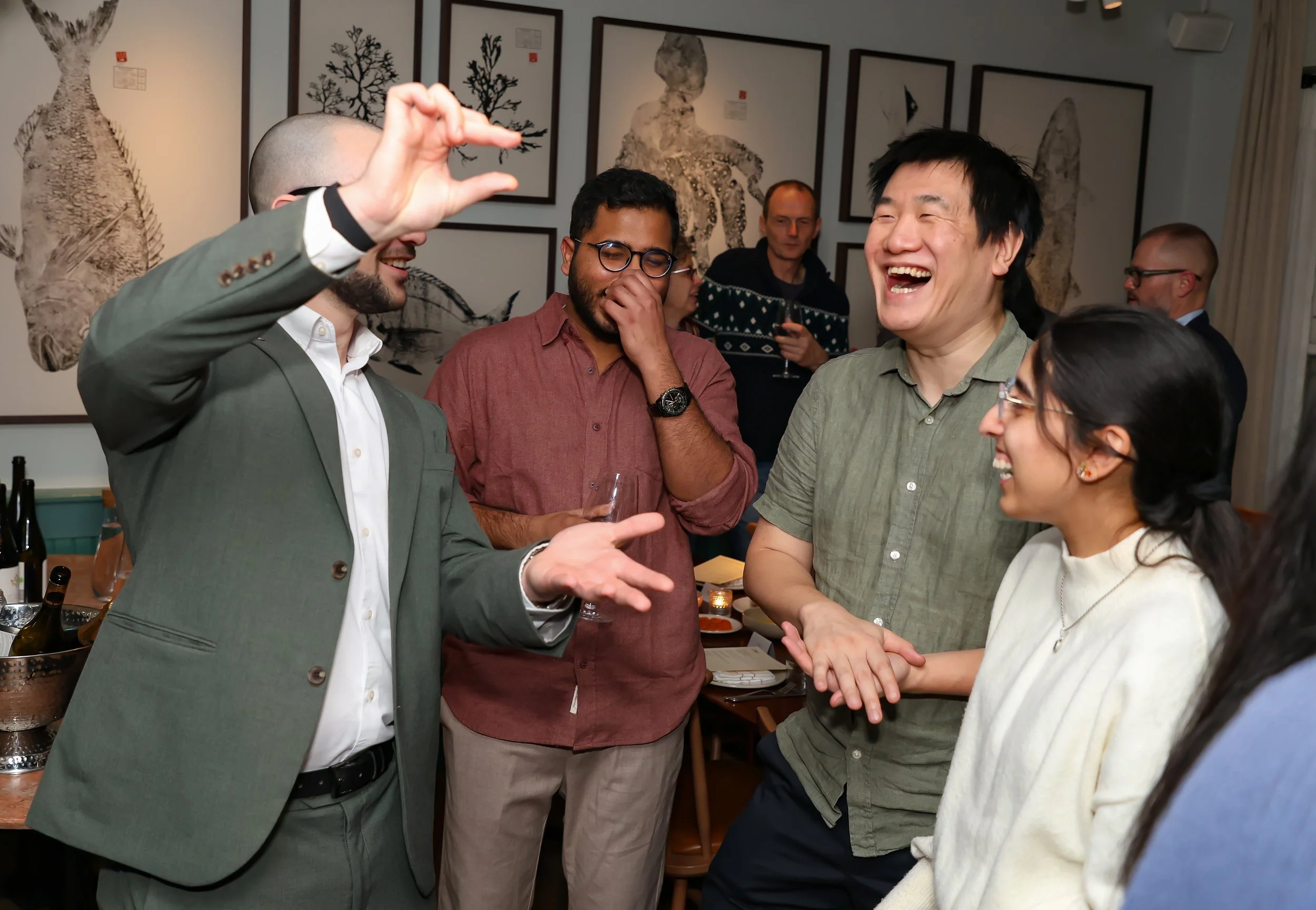 Small-group interactive magic creating moments of laughter and surprise for guests.