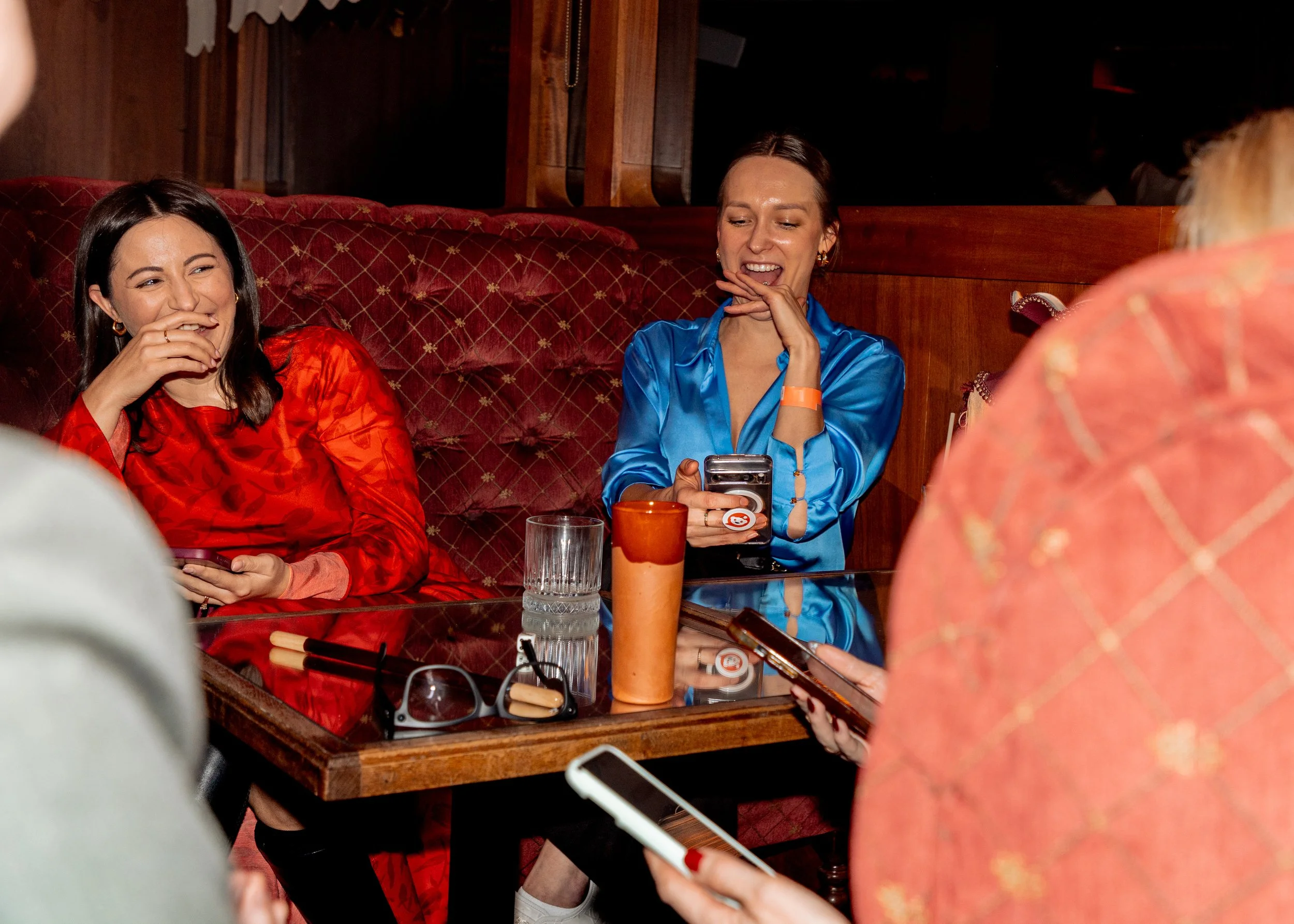Guests watching interactive table side close-up magic.