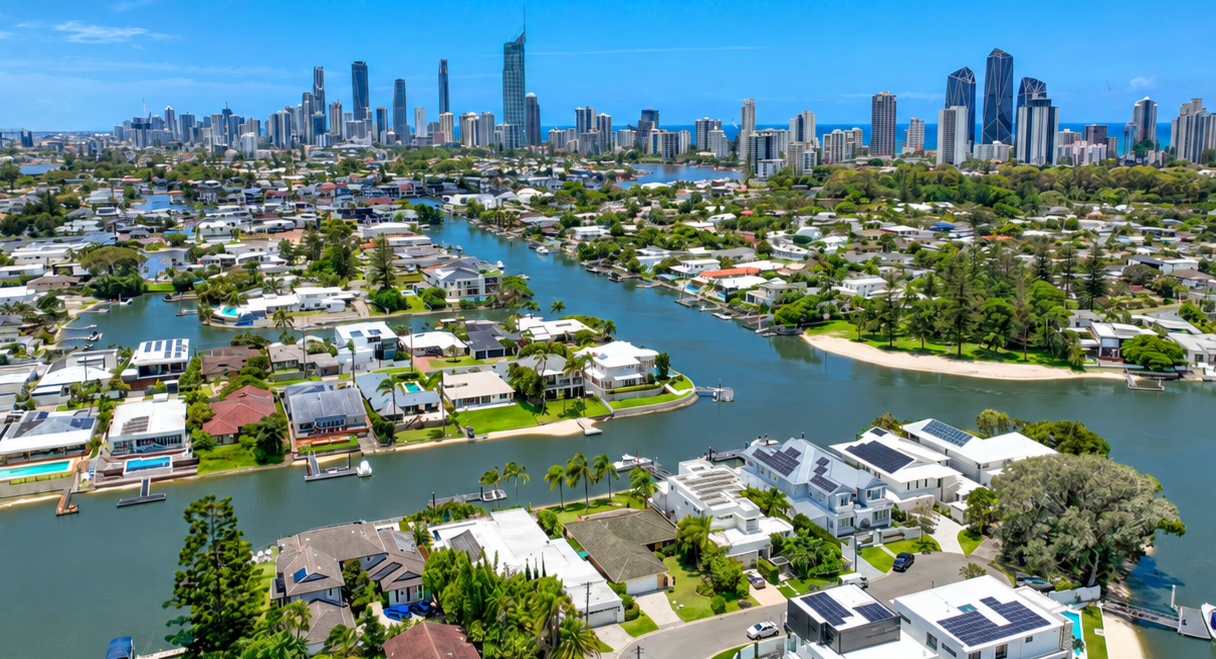 Canal+Homes+Beneath+the+Coastal+Skyline.png