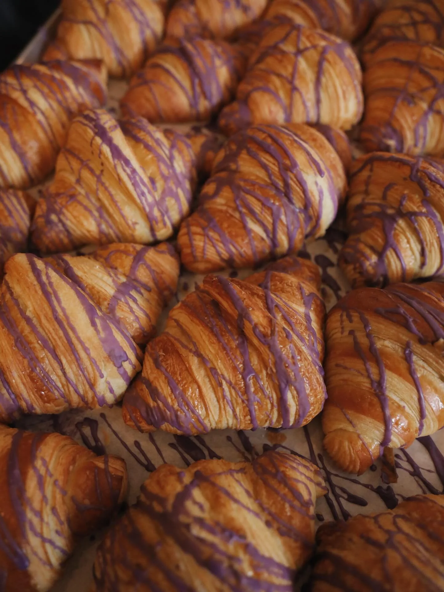 Our most-loved pastry for a reason 💜

Buttery, flaky layers filled with in-house ube halaya and rice; inspired by the comforting flavors of traditional ube champorado. A nostalgic Filipino classic, reimagined as a croissant. Available every day excl