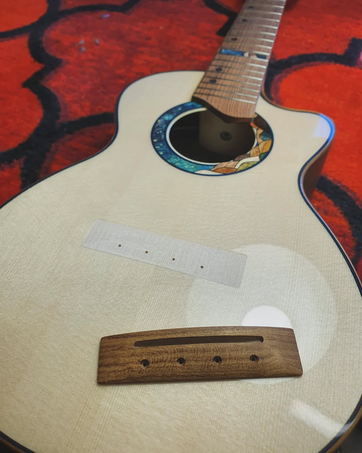 Carefully removing the finish from the bridge footprint and glueing it onto the top is the last real bit of woodwork on an instrument before completion. 

I'm really excited to hear how this concert ukulele sounds! 

#luthier #woodwork #woodworking #