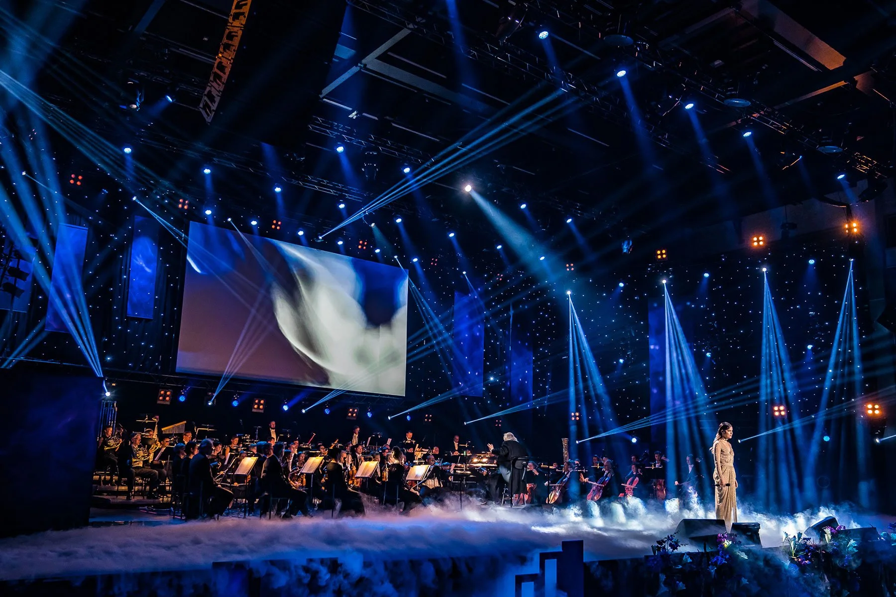 Full orchestra performing on the main stage at a Logomo gala dinner, Turku.