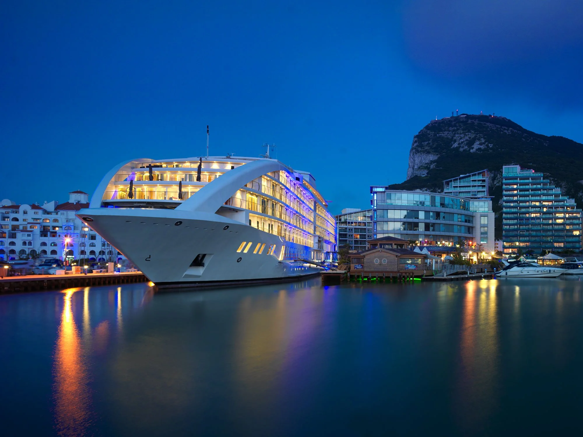 Sunborn Gibraltar floating hotel lit up at night, Ocean Village Marina, Gibraltar.