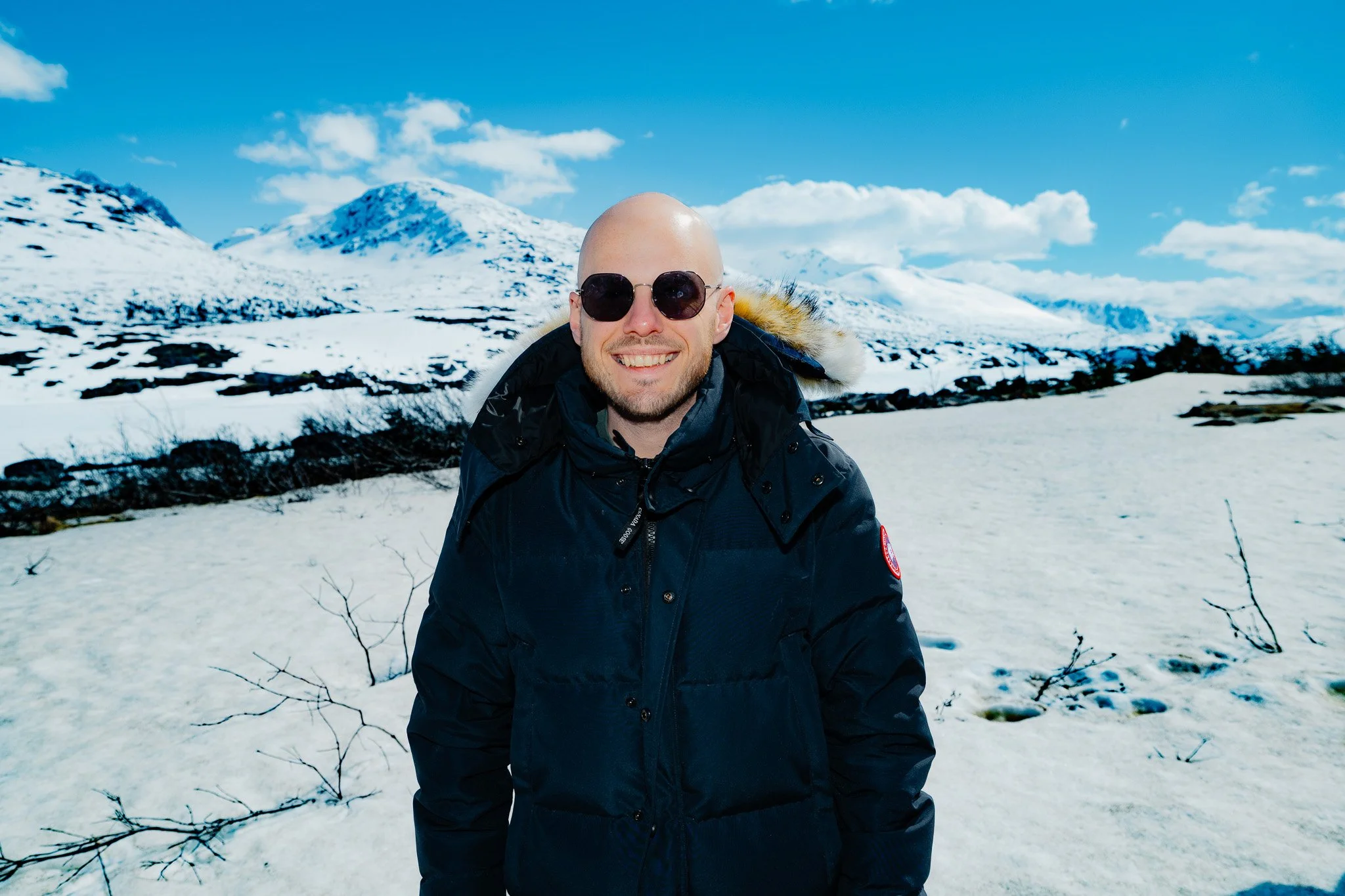 David with snow and mountains behind