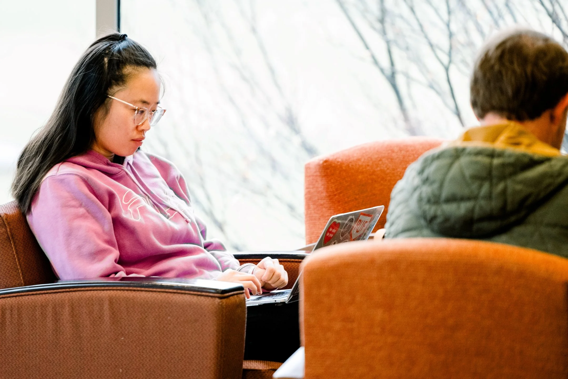 A female student studying on a laptop